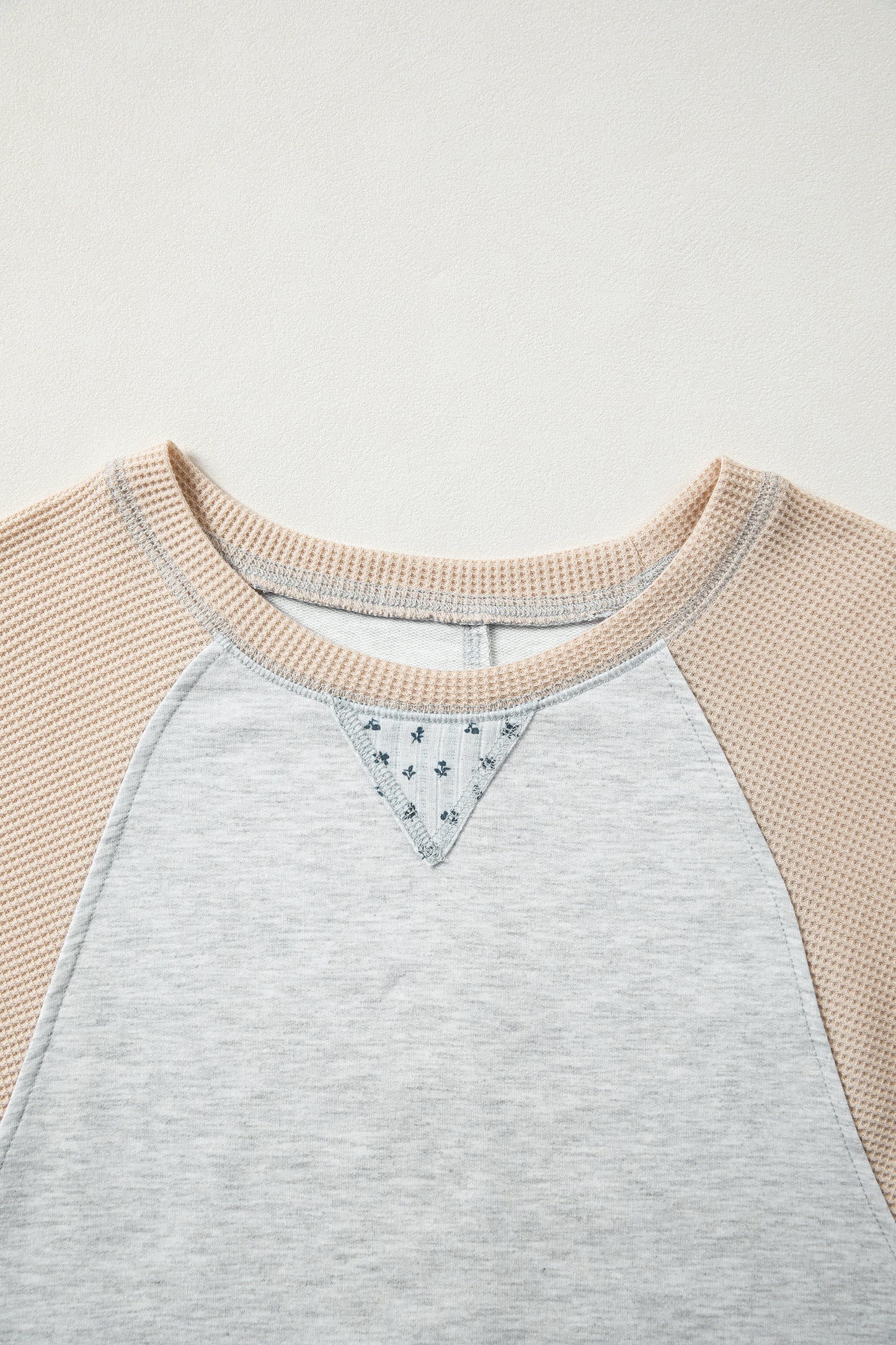 Light grey mixed print raglan sleeve blouse with patchwork and exposed seams by Lavender Lane Clothing