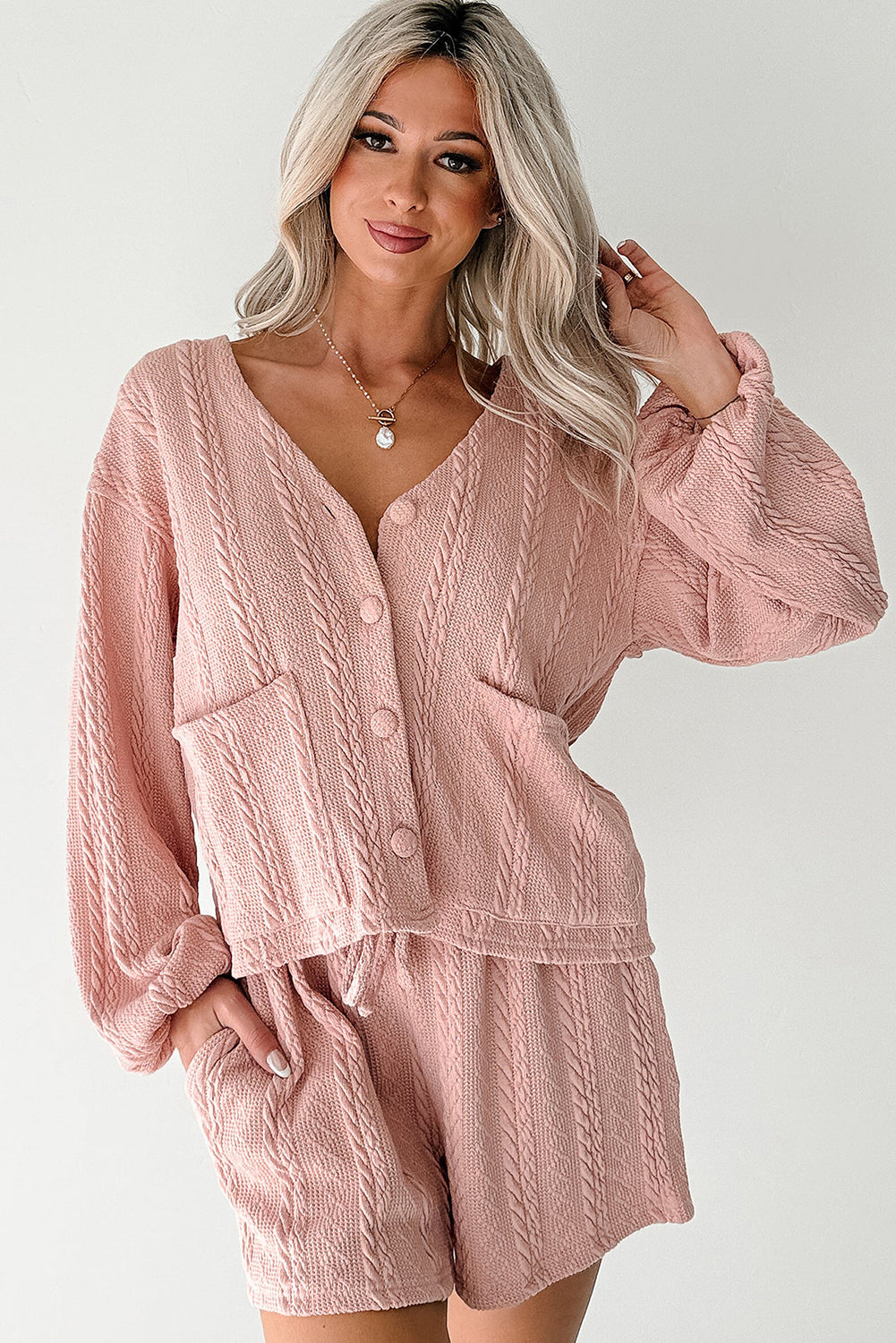 Lavendar Lane Pink Cable Knit V Neck Cardigan and Shorts Set, two-piece summer outfit with cozy knit fabric and stylish V-neck design.