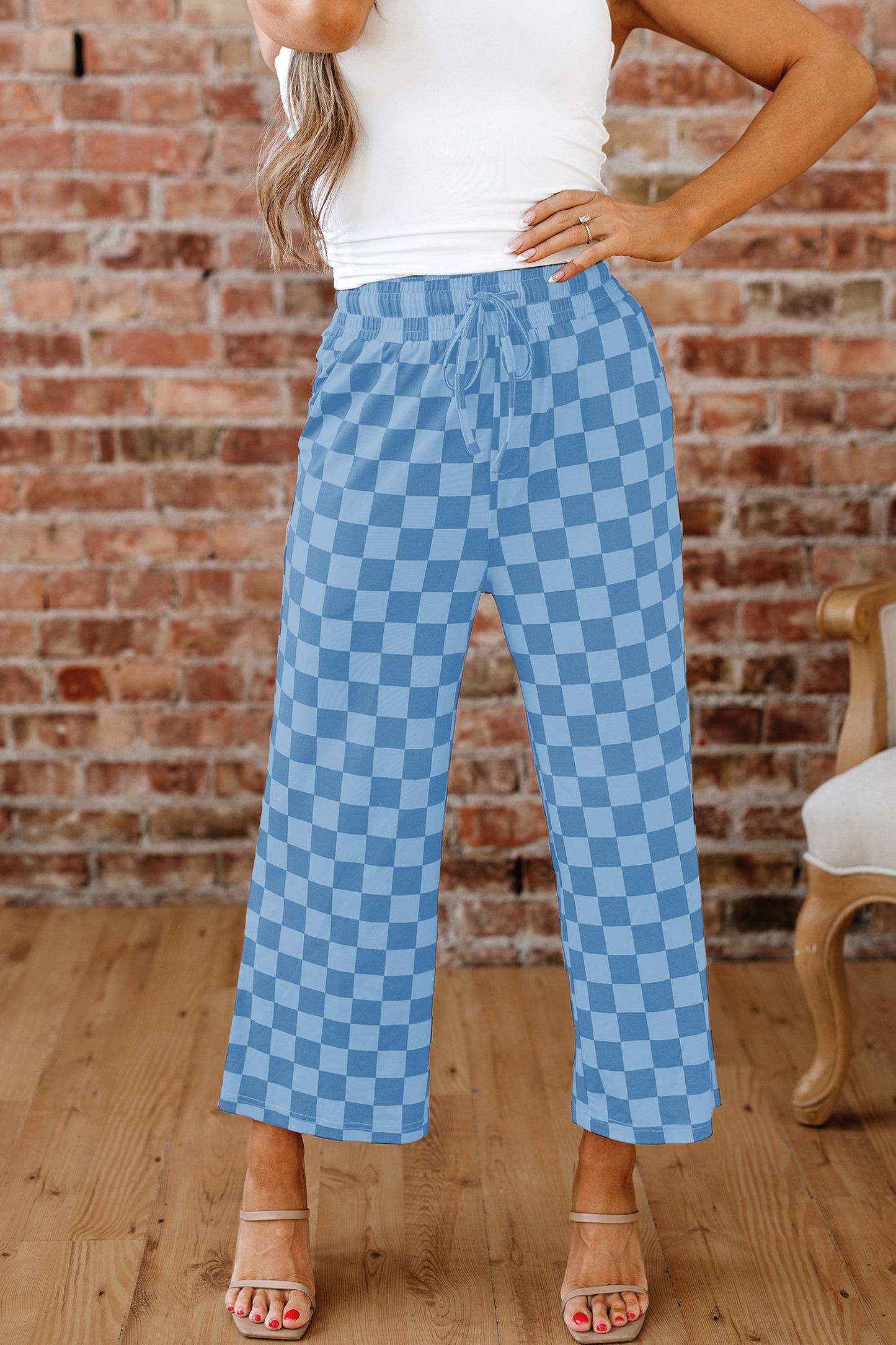 Sky blue checkered elastic high waist casual pants from Lavender Lane Clothing, loose fit with comfortable waistband.