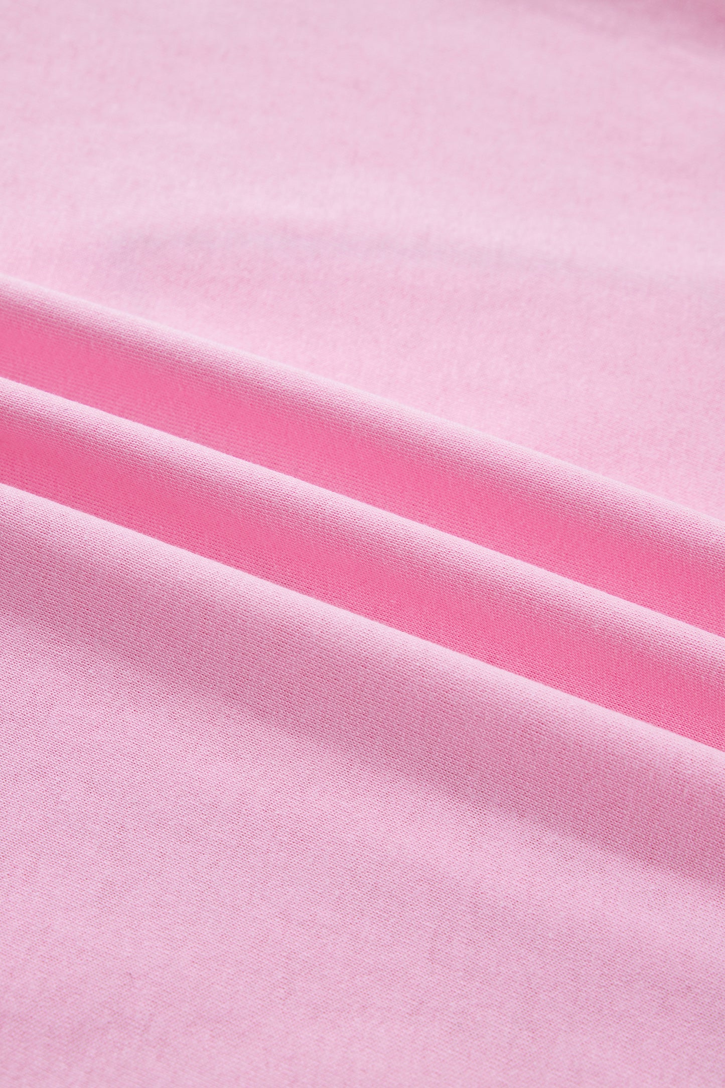 Pink leopard embroidered cotton round neck T-shirt from Lavendar Lane Clothing, featuring a playful bow detail and comfortable fit.