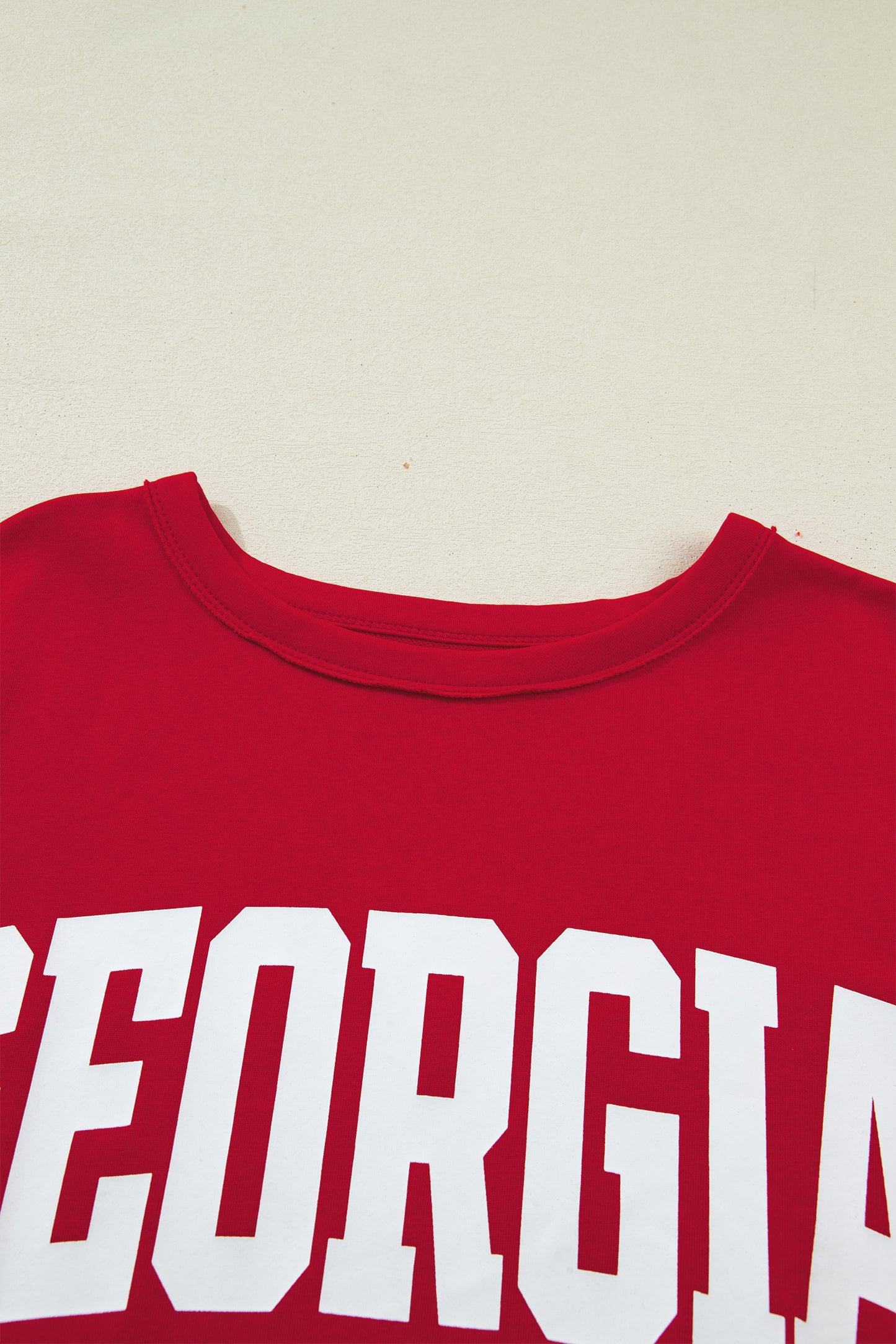 Lavendar Lane Clothing Racing Red Georgia letter printed raw seam drop shoulder loose blouse, casual and stylish.
