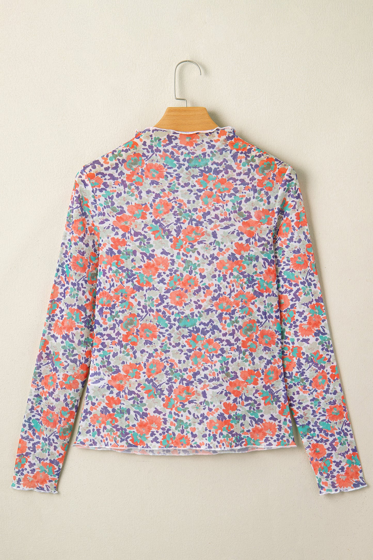 Blue slim fit floral mesh long sleeve mock neck top by Lavender Lane Clothing, featuring a stylish and lightweight design.