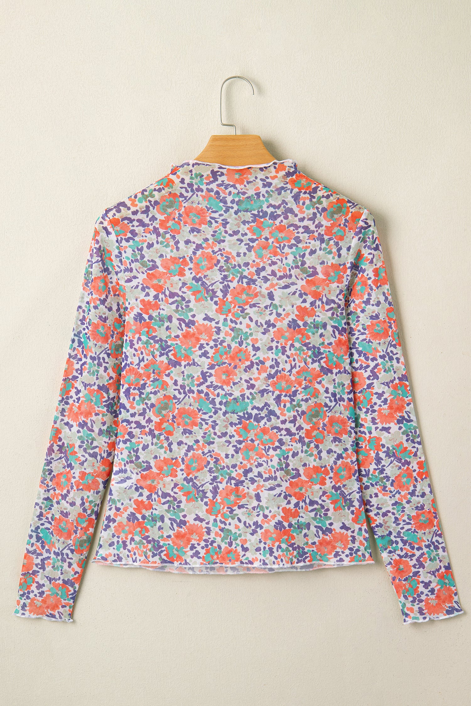 Blue slim fit floral mesh long sleeve mock neck top by Lavender Lane Clothing, featuring a stylish and lightweight design.