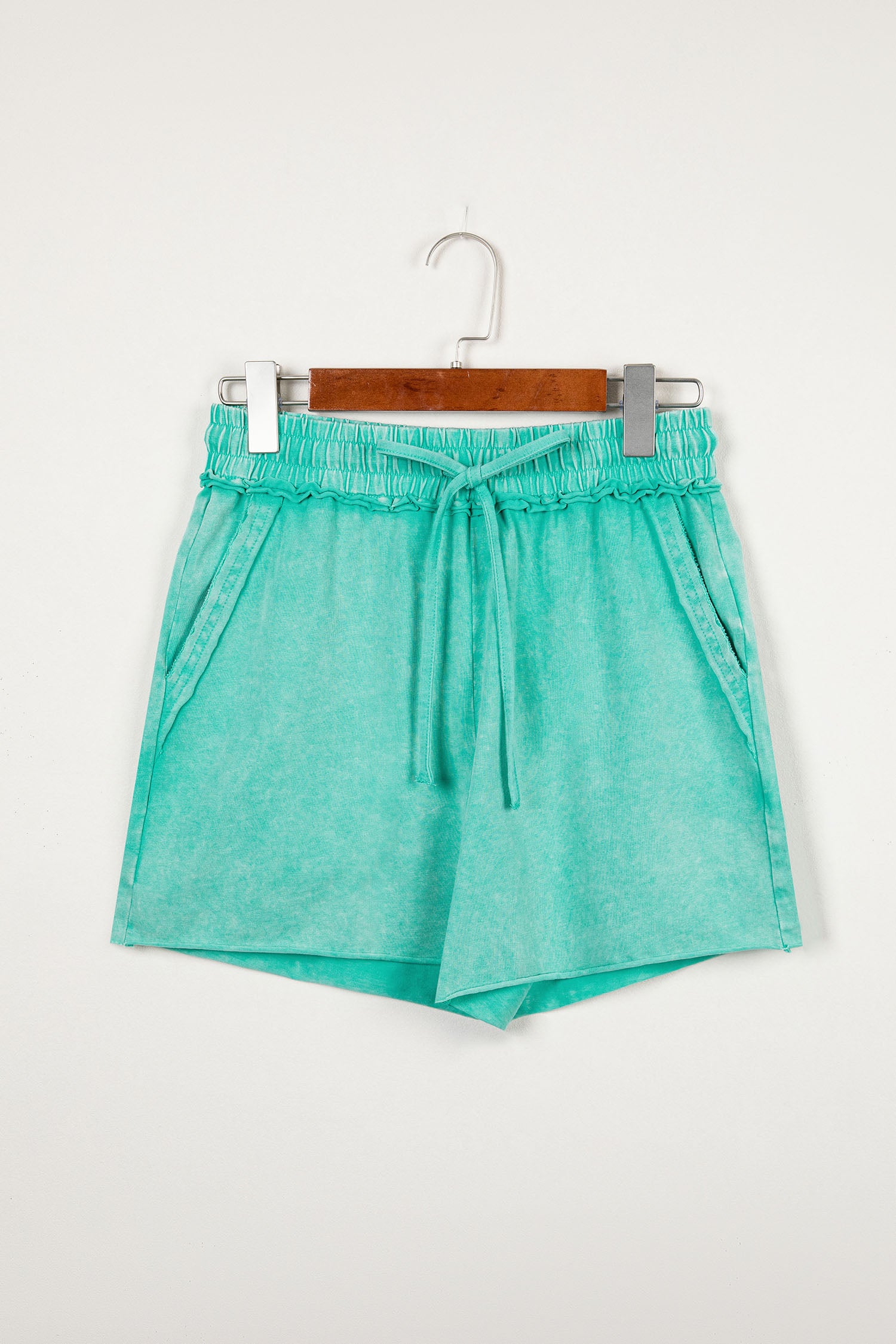 Sea green mineral washed casual shorts with drawstring waist and raw cut hem by Lavendar Lane Clothing