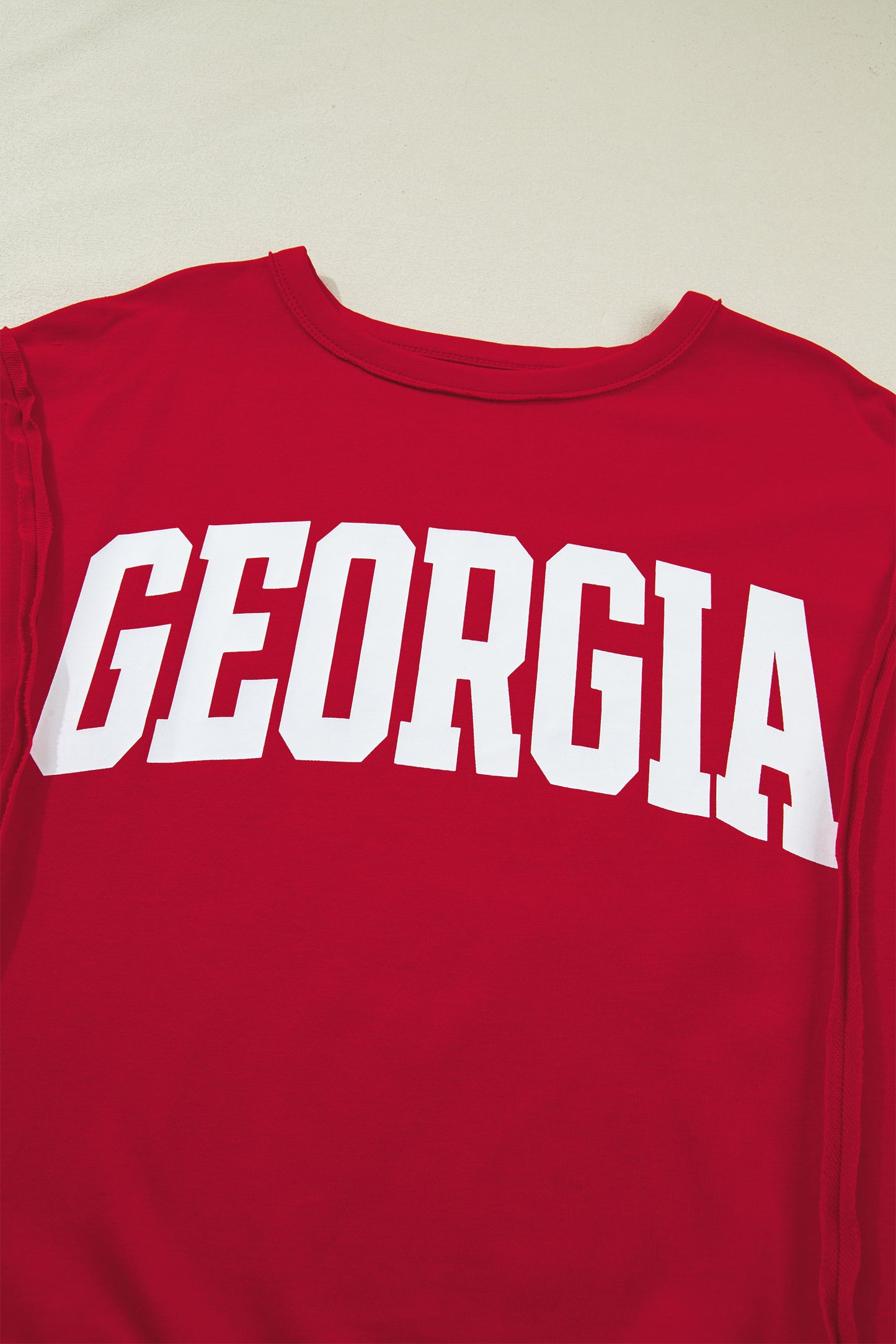 Lavendar Lane Clothing Racing Red Georgia letter printed raw seam drop shoulder loose blouse.