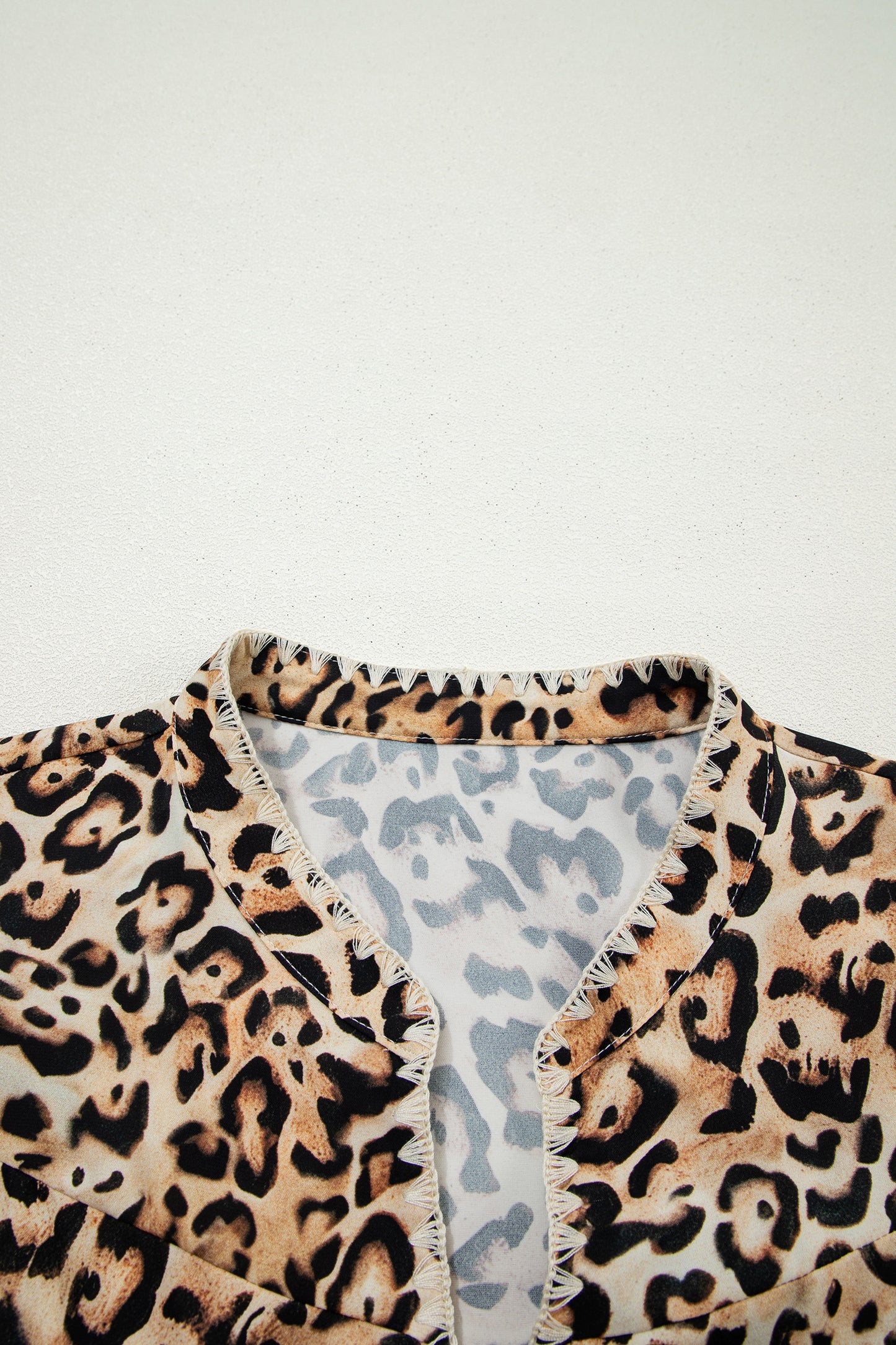 Khaki plus size leopard print blouse with ruffled short sleeves and stitch detail, from Lavender Lane Clothing.