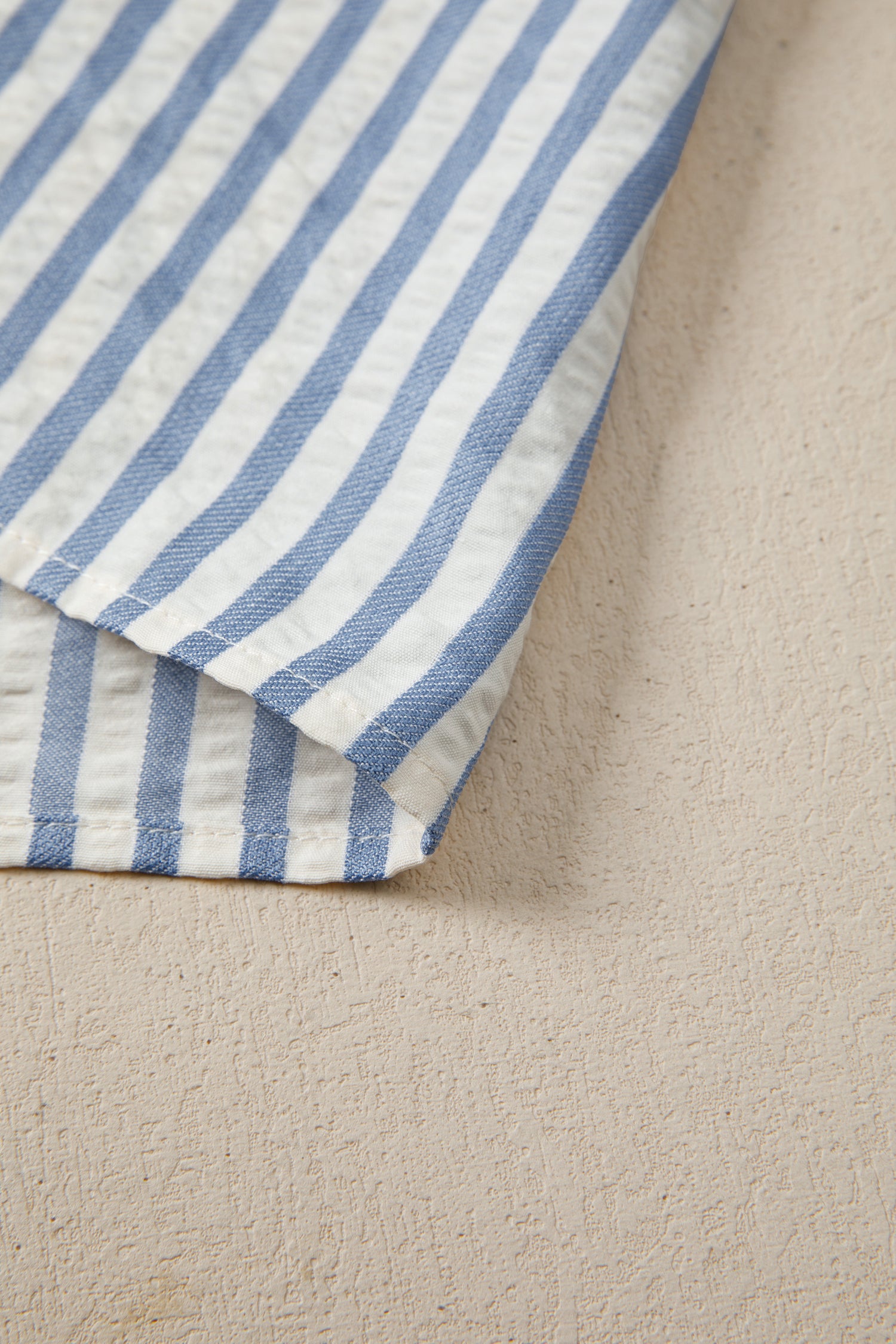 Sky blue stripe leopard trim V-neck button-down blouse by Lavendar Lane Clothing, featuring half sleeves and stylish design.
