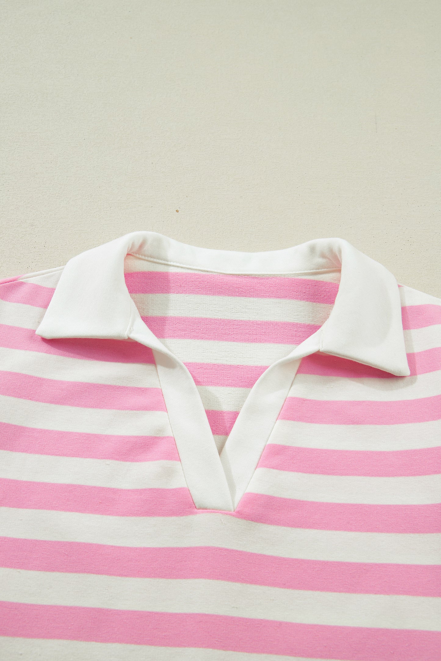 Pink striped collar V-neck blouse with ruffled short sleeves by Lavender Lane Clothing, stylish and feminine top.