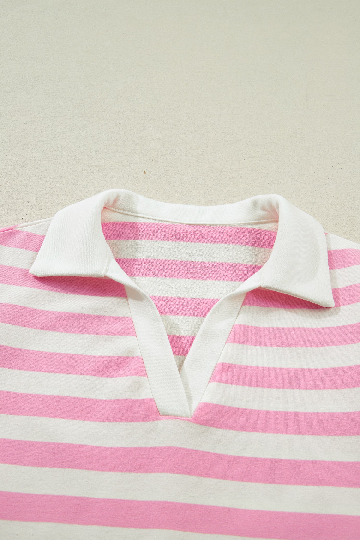 Pink striped collar V-neck blouse with ruffled short sleeves by Lavender Lane Clothing, stylish and feminine top.