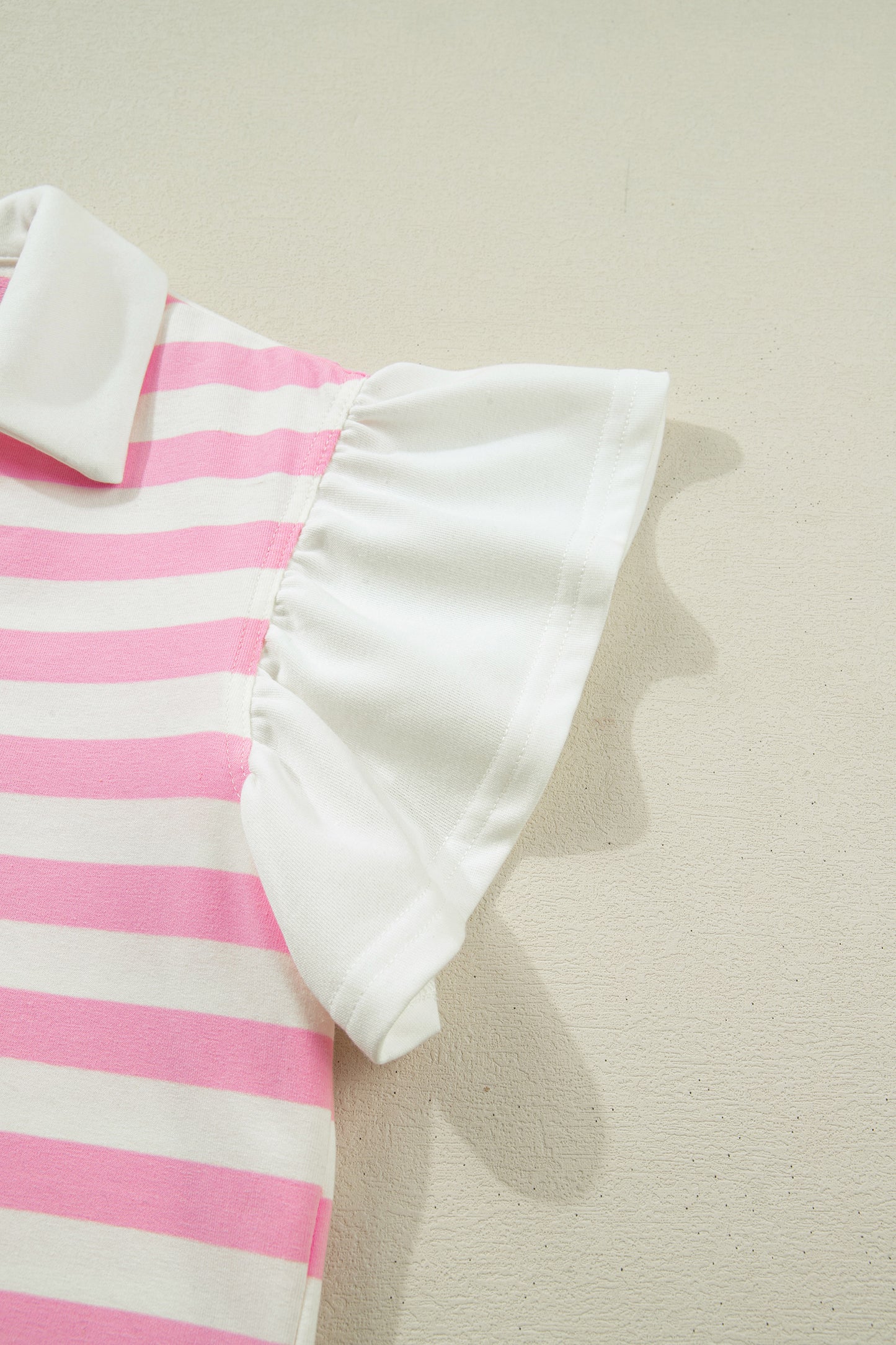 Pink striped collar V-neck blouse with ruffled short sleeves by Lavender Lane Clothing, featuring a stylish, feminine design.