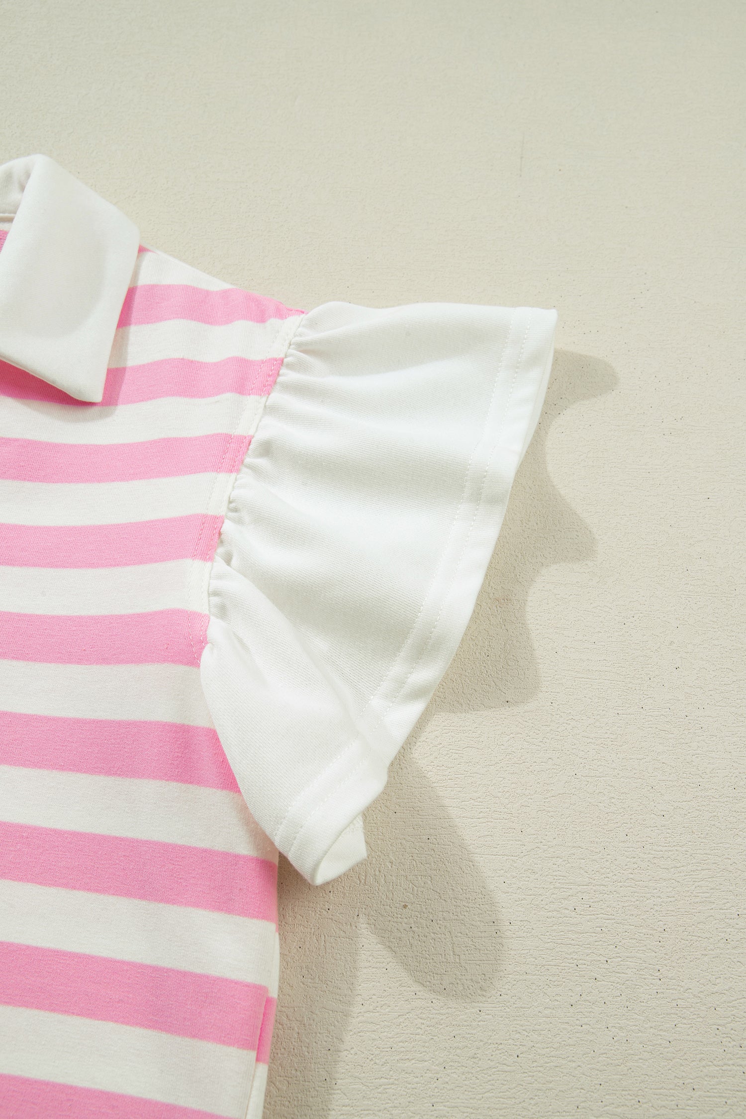Pink striped collar V-neck blouse with ruffled short sleeves by Lavender Lane Clothing, featuring a stylish, feminine design.