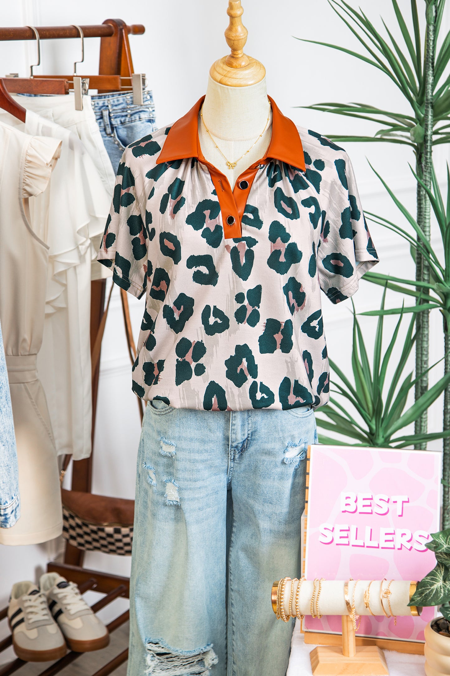 Leopard print button-up blouse with contrast collar and short sleeves from Lavendar Lane Clothing, casual and unique design.