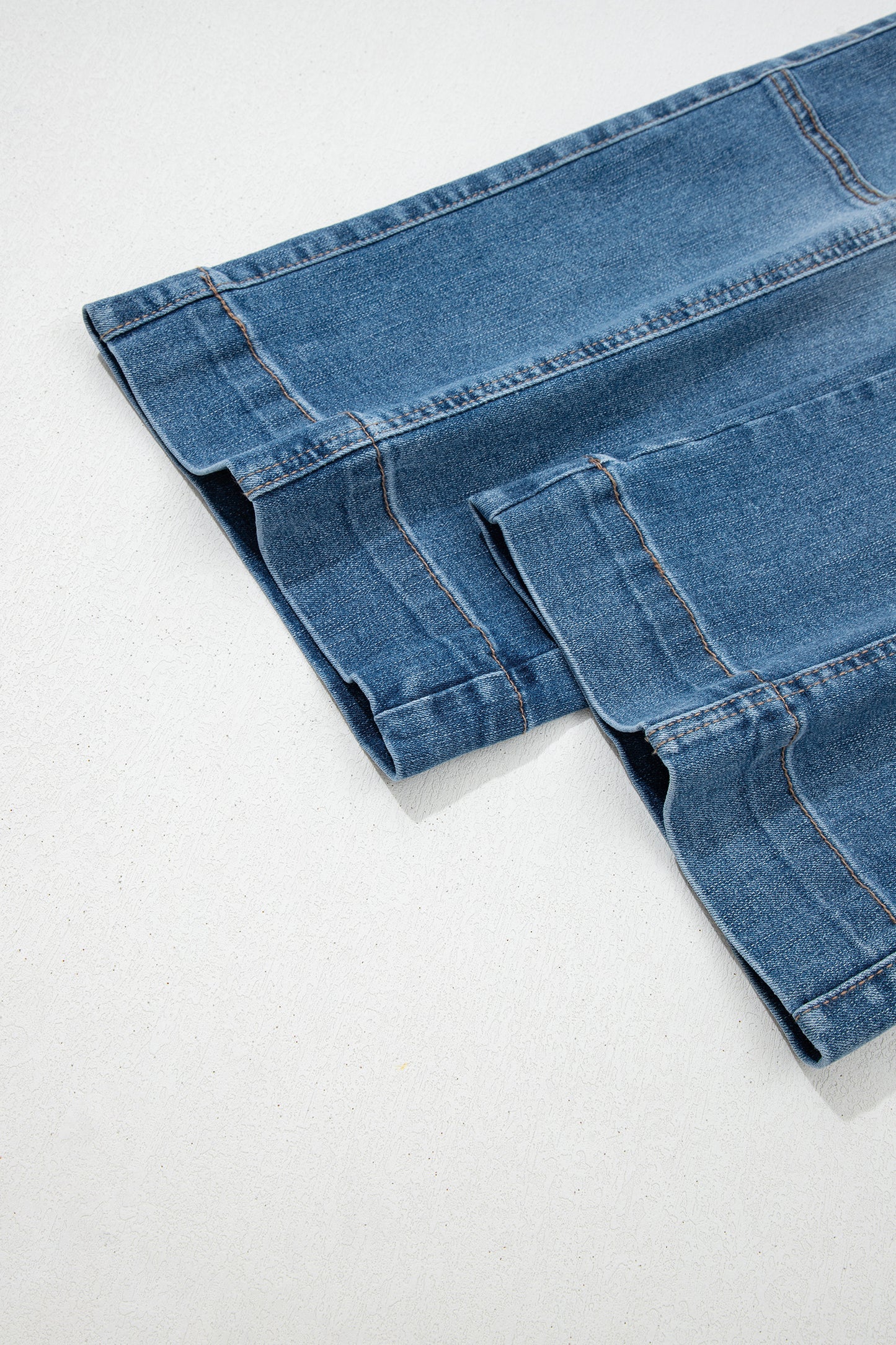 Lavendar Lane Clothing Sail Blue straight jeans with exposed stitching, showcasing a fitted denim bottom with classic details.