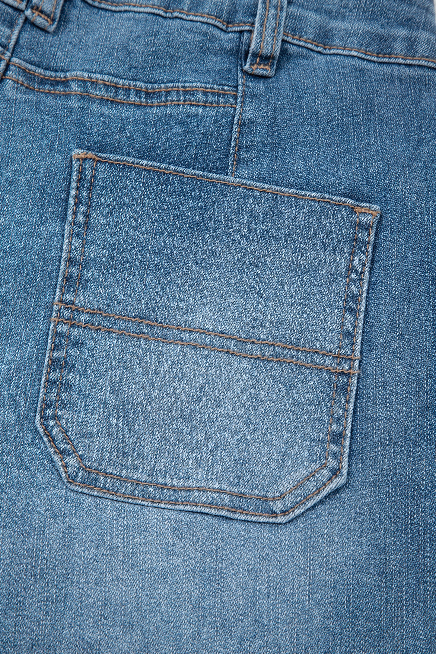 Lavendar Lane Clothing Sail Blue straight jeans with exposed stitching, showcasing classic denim style and slim fit design.