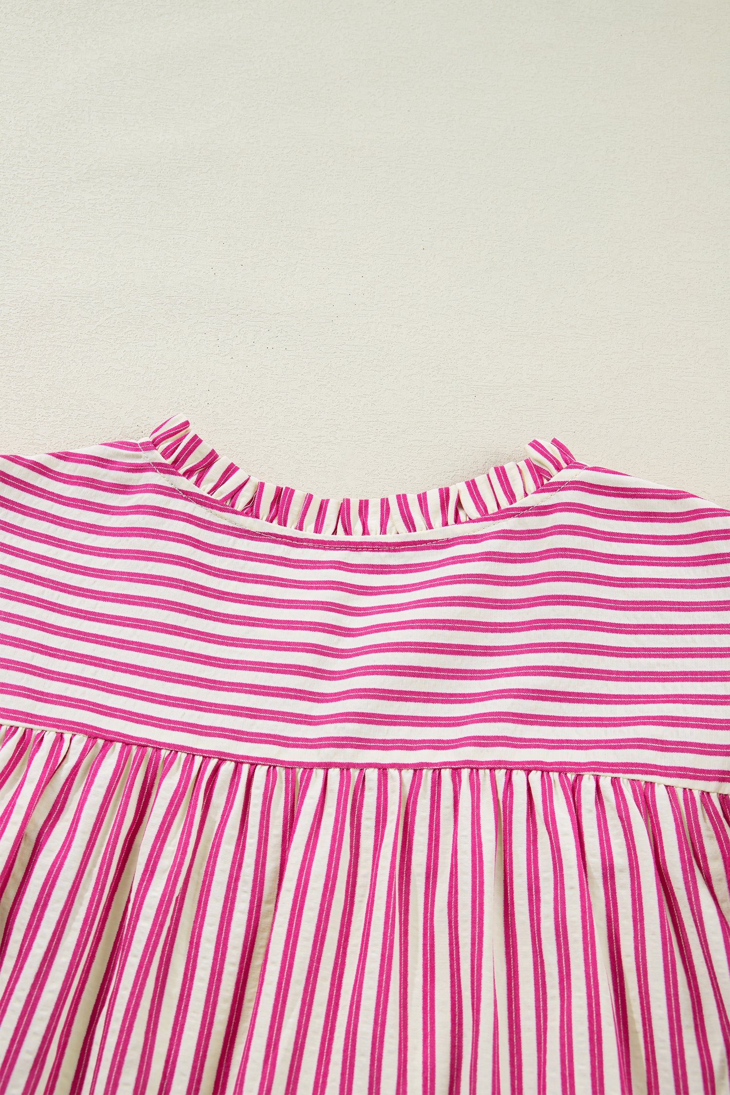 Lavendar Lane Clothing rose stripe blouse with shirred yoke and ruffled short sleeves, lightweight and stylish for casual wear.