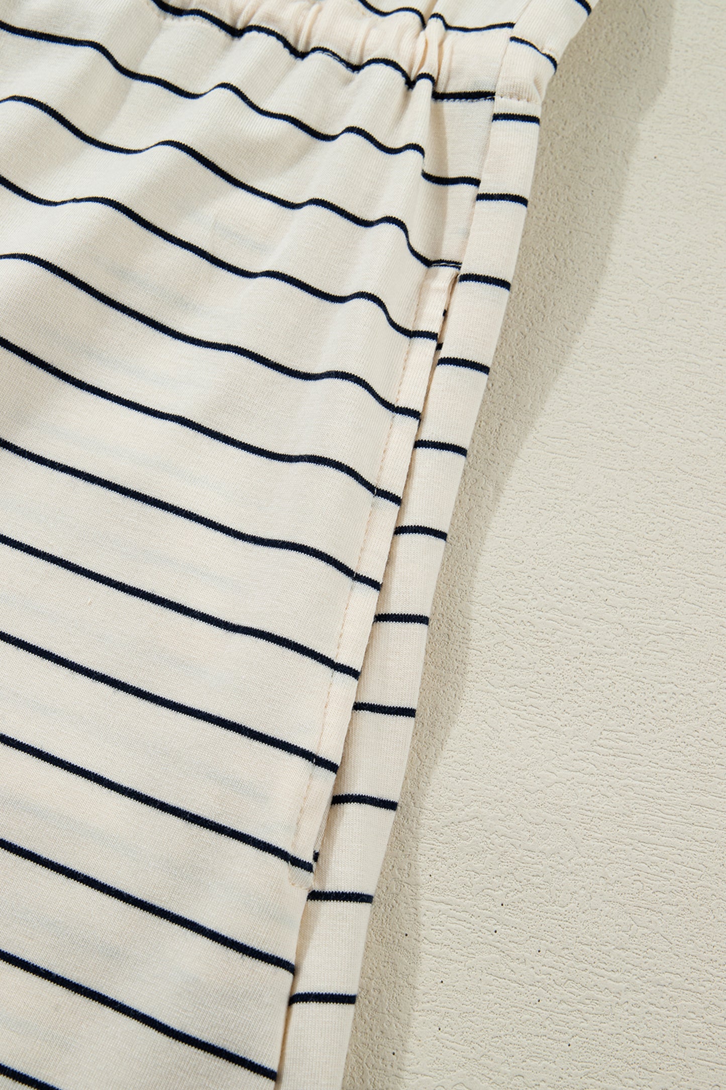 Beige stripe drawstring tunic mini dress with pockets from Lavendar Lane Clothing, featuring casual, comfortable style.