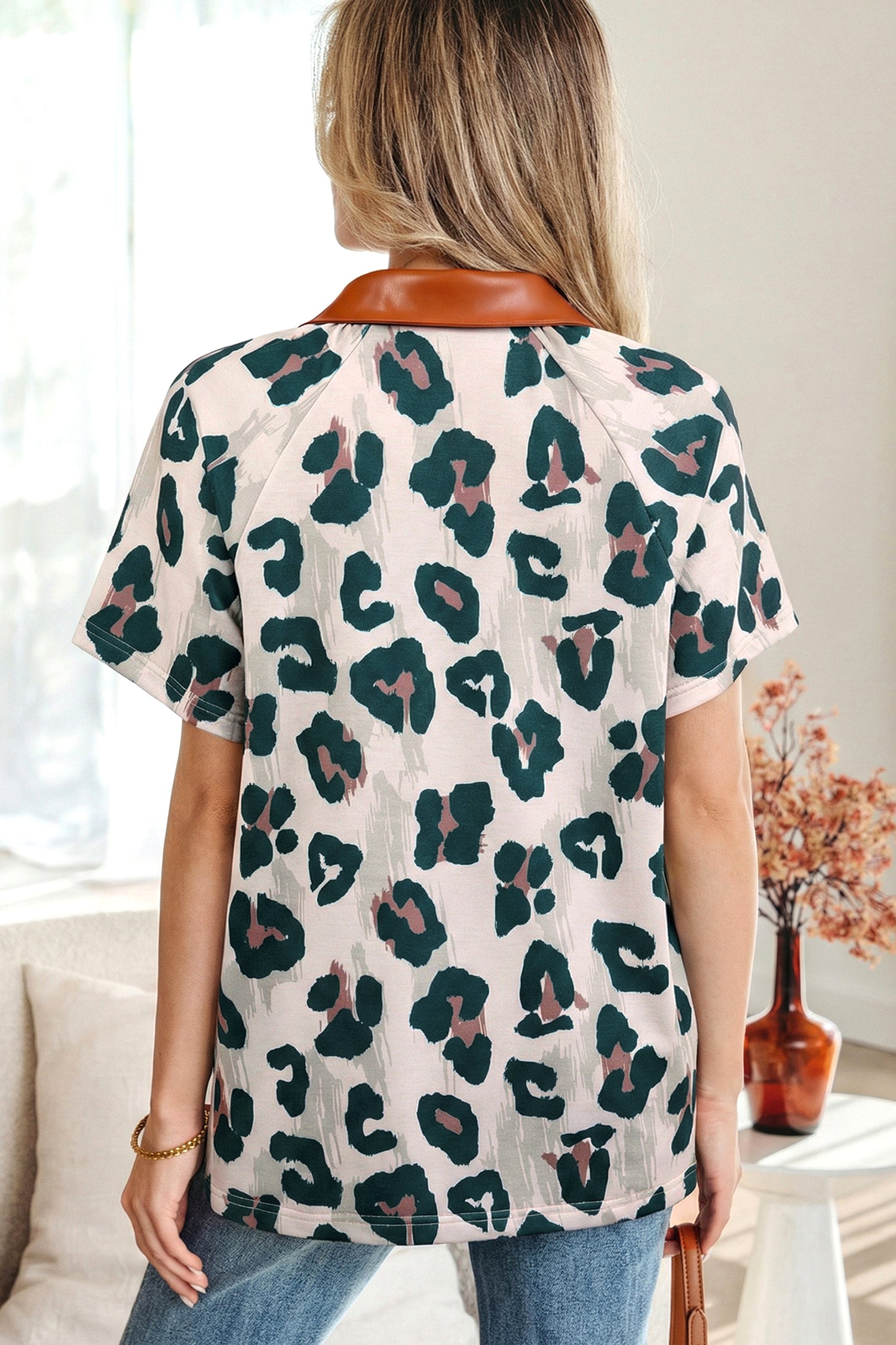 Leopard print casual blouse from Lavendar Lane Clothing featuring contrast collar and short sleeves, stylish and comfortable for everyday wear.