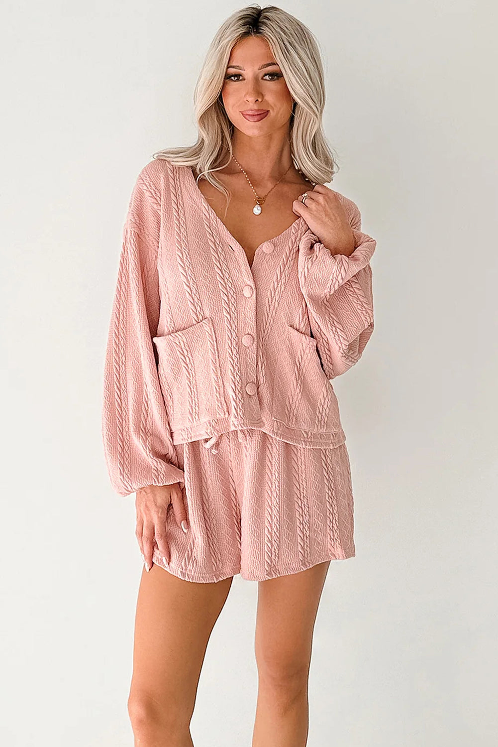 Lavendar Lane Clothing pink cable knit V-neck cardigan and matching shorts set, two-piece outfit with a cozy, stylish look.