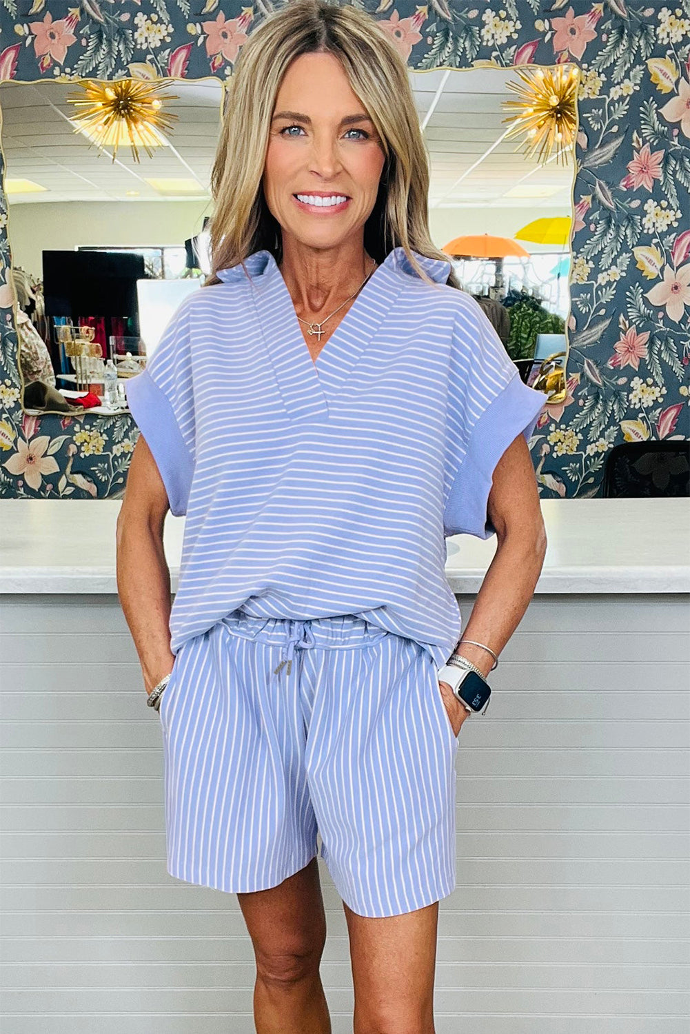Sky blue stripe dolman sleeve polo shirt and drawstring shorts set by Lavendar Lane Clothing, featuring casual, comfortable summer wear.