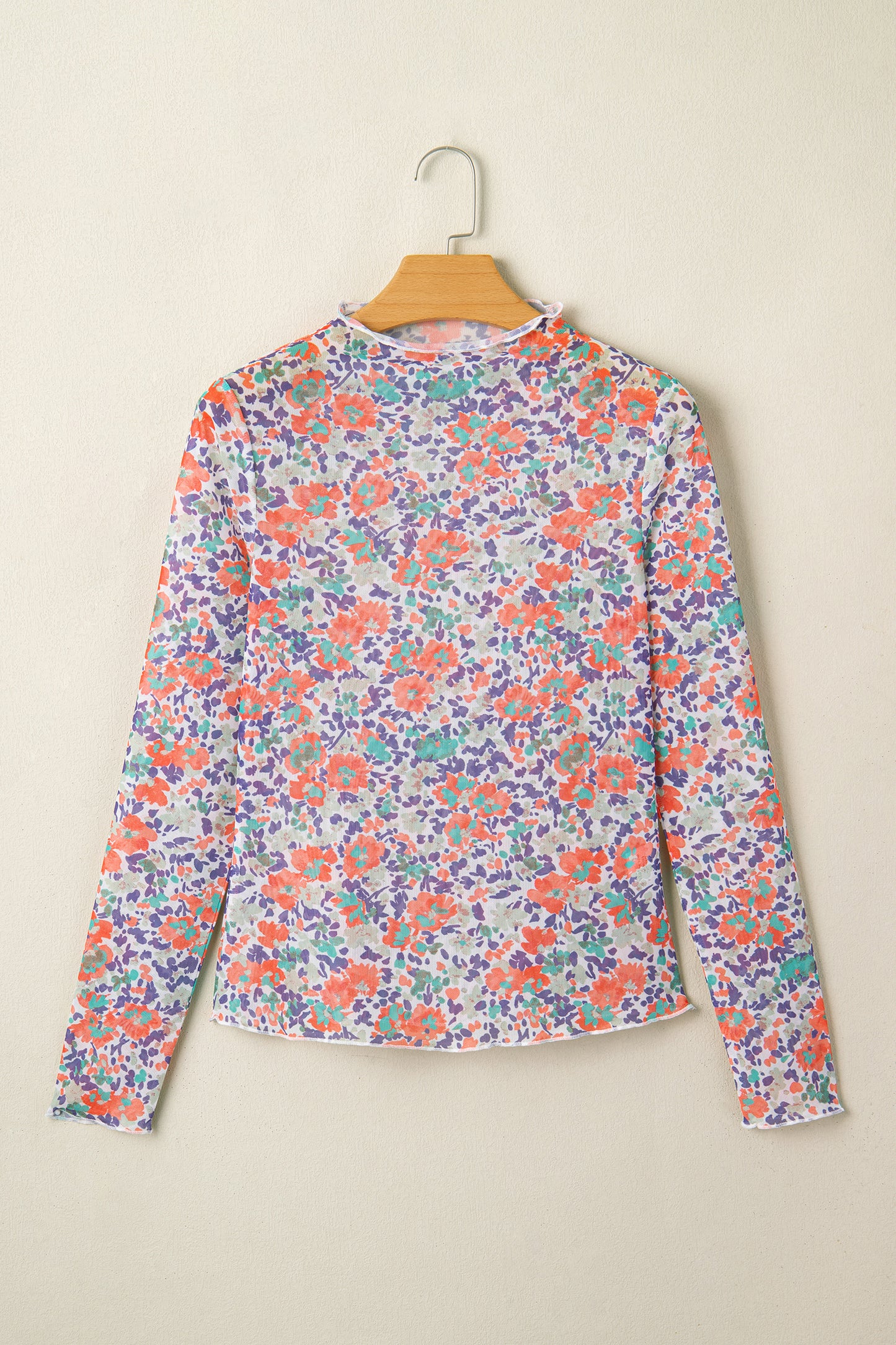 Blue slim fit floral mesh long sleeve mock neck top by Lavender Lane Clothing, featuring a stylish floral pattern and fitted design.