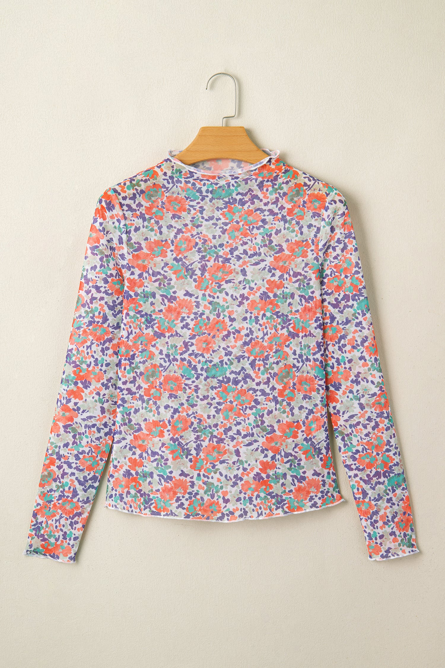 Blue slim fit floral mesh long sleeve mock neck top by Lavender Lane Clothing, featuring a stylish floral pattern and fitted design.
