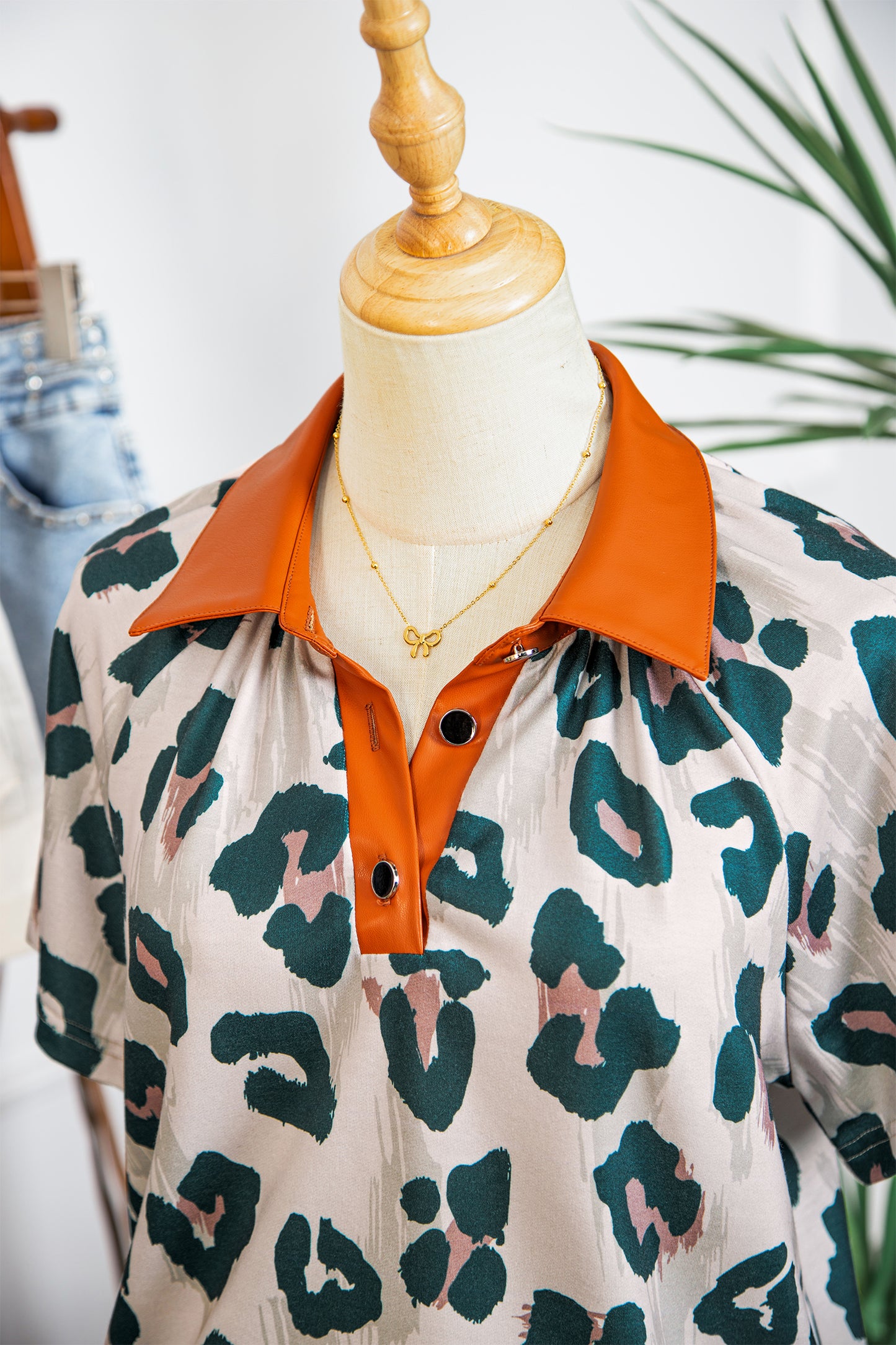 Lavendar Lane leopard print short sleeve blouse with contrast collar, casual and unique design, perfect for stylish everyday wear.