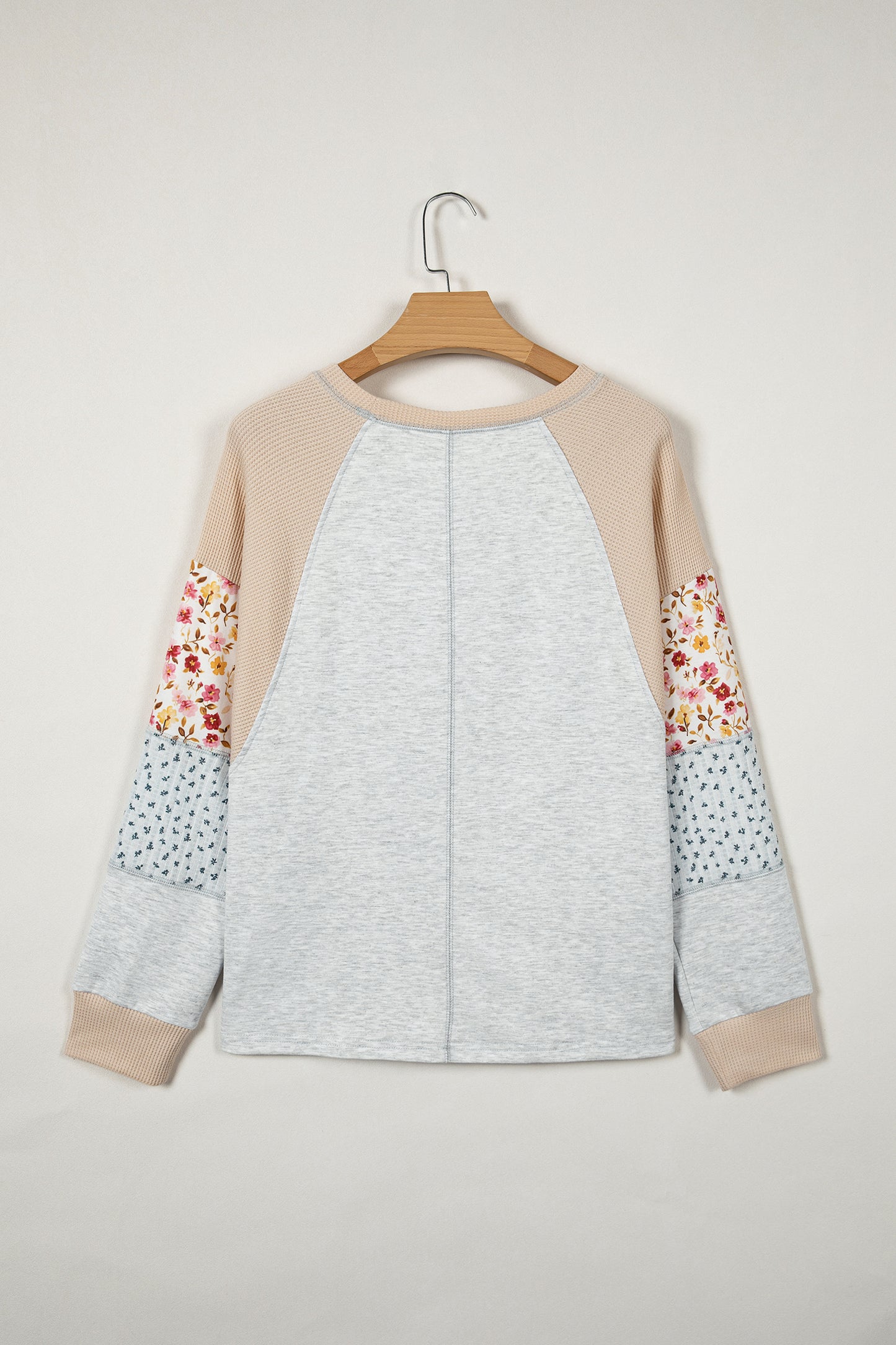 Light grey mixed print raglan sleeve blouse with patchwork and exposed seams from Lavender Lane Clothing.