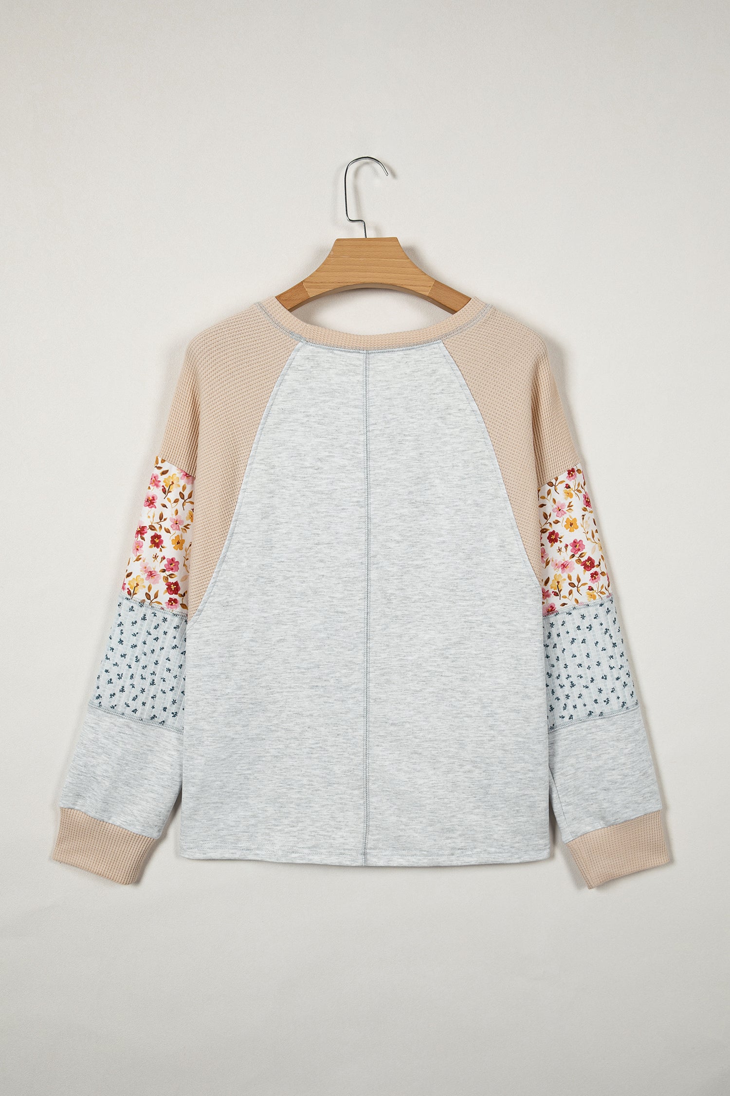 Light grey mixed print raglan sleeve blouse with patchwork and exposed seams from Lavender Lane Clothing.