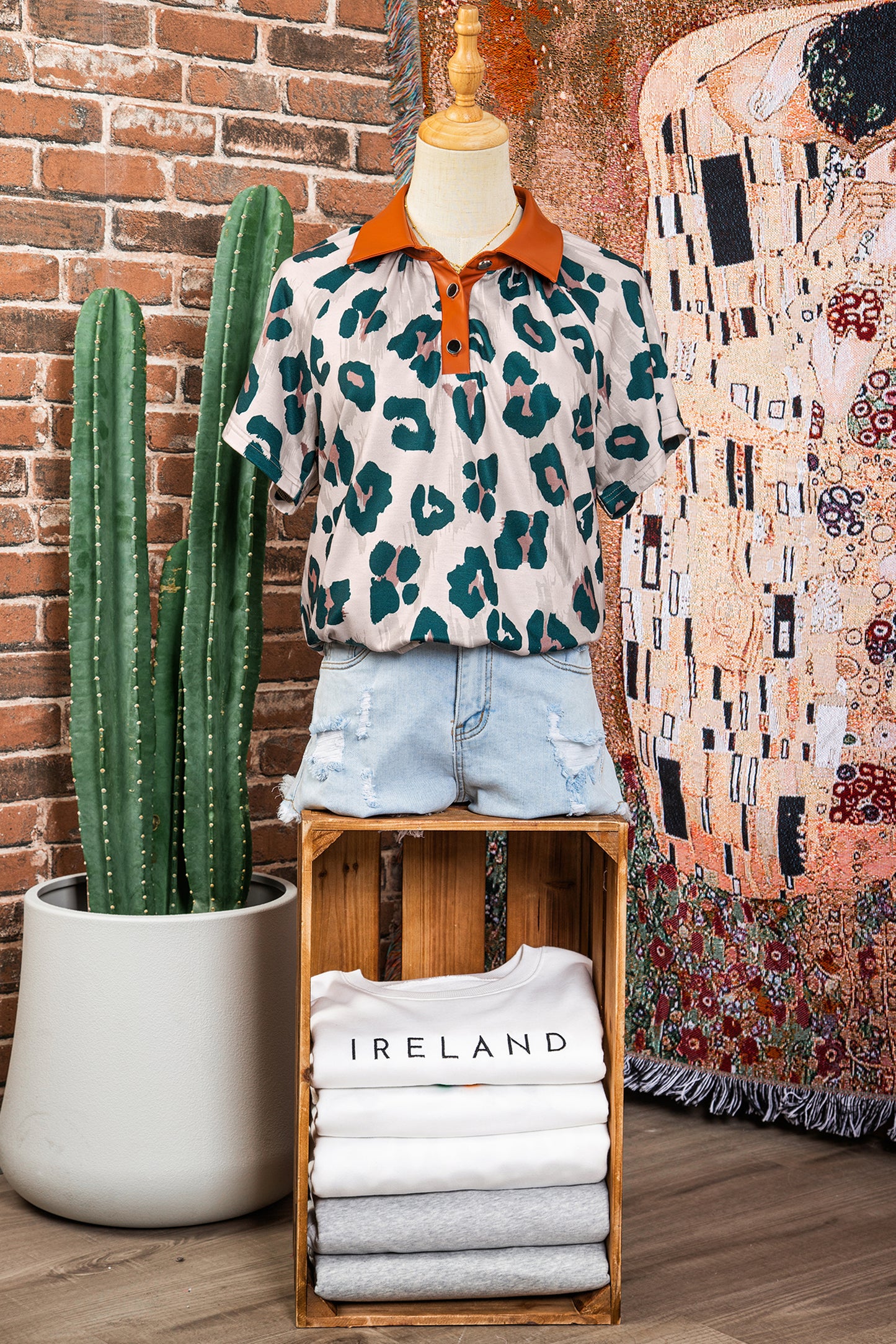 Lavendar Lane leopard print short sleeve blouse with contrast collar, casual and unique design, perfect for stylish everyday wear.
