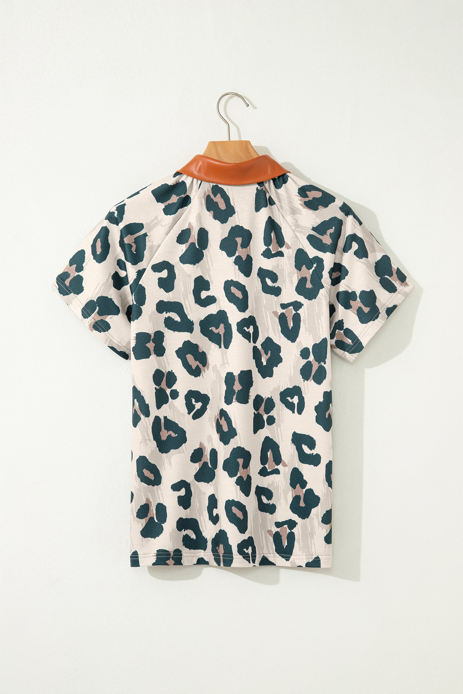 Lavendar Lane leopard print short sleeve blouse with contrast collar and button detail, casual and unique top for stylish wear.