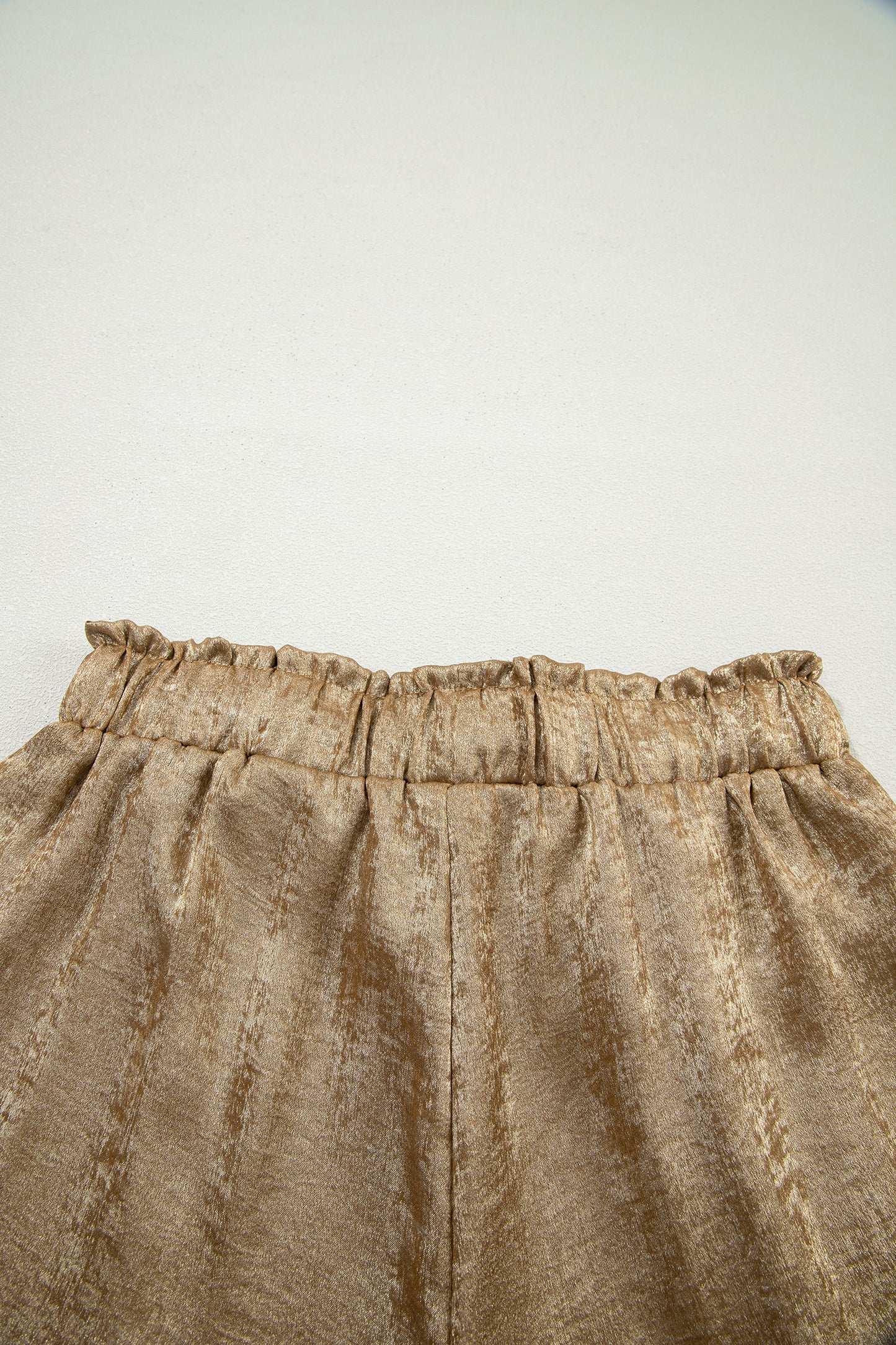 Gold metallic luster tie elastic waist casual shorts with cuffed hems by Lavendar Lane Clothing, perfect for stylish summer wear.