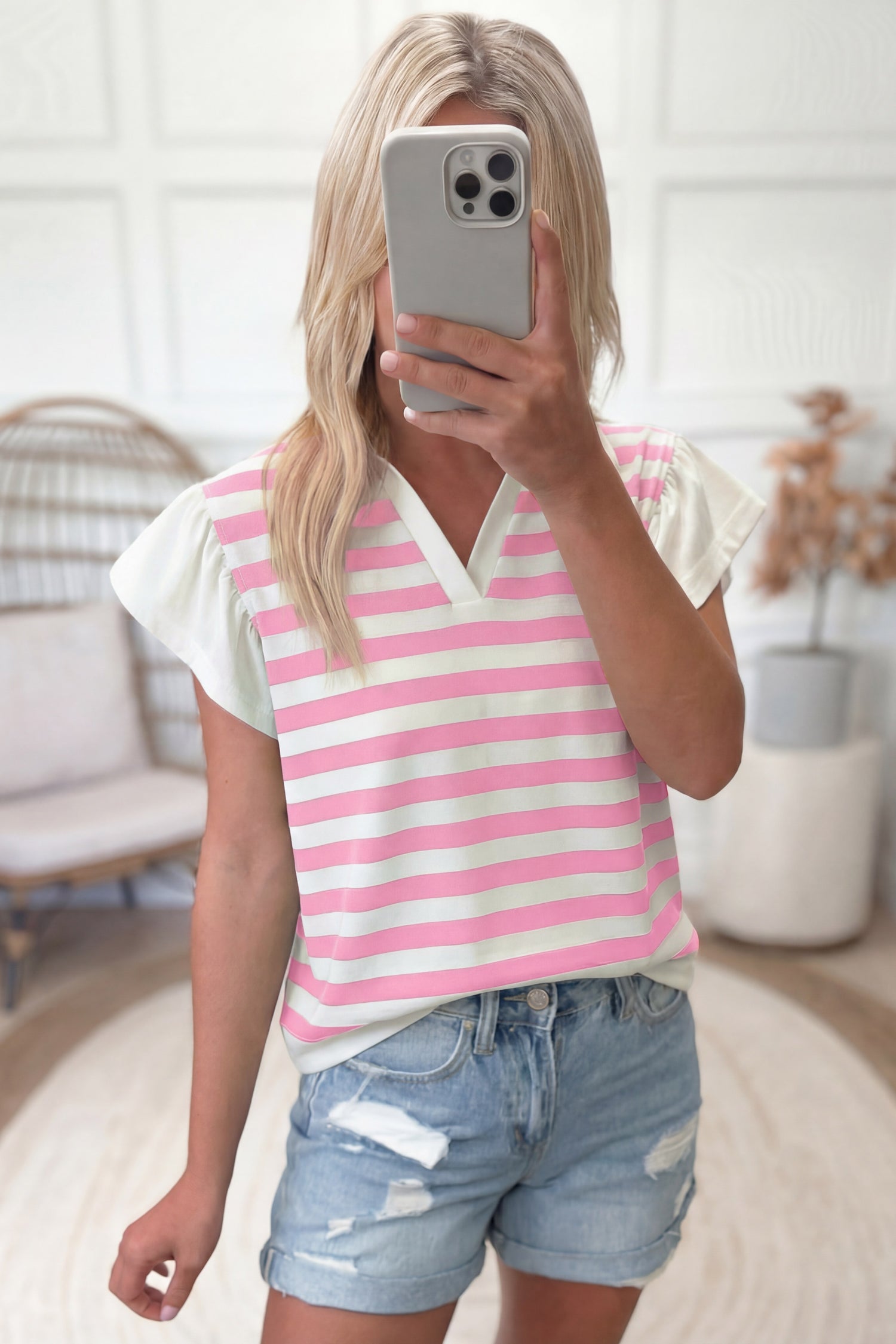 Pink stripe collar V-neck ruffled short sleeve blouse by Lavender Lane Clothing, featuring a feminine design and stylish details.