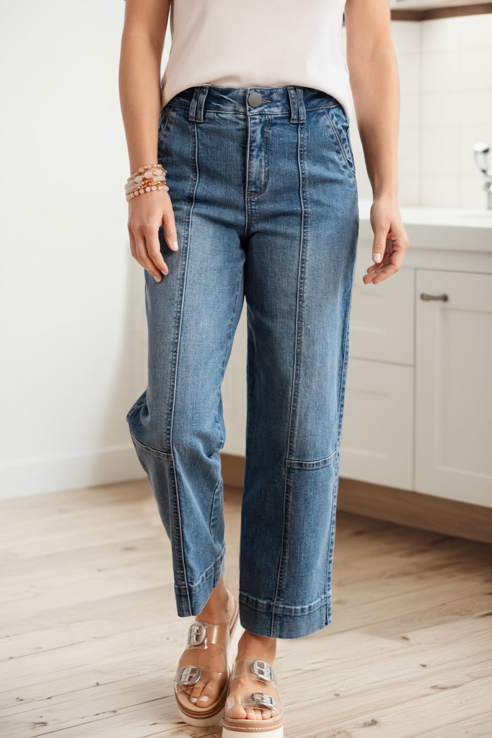 Lavendar Lane Clothing Sail Blue straight jeans with exposed stitching, classic denim bottoms for casual wear.