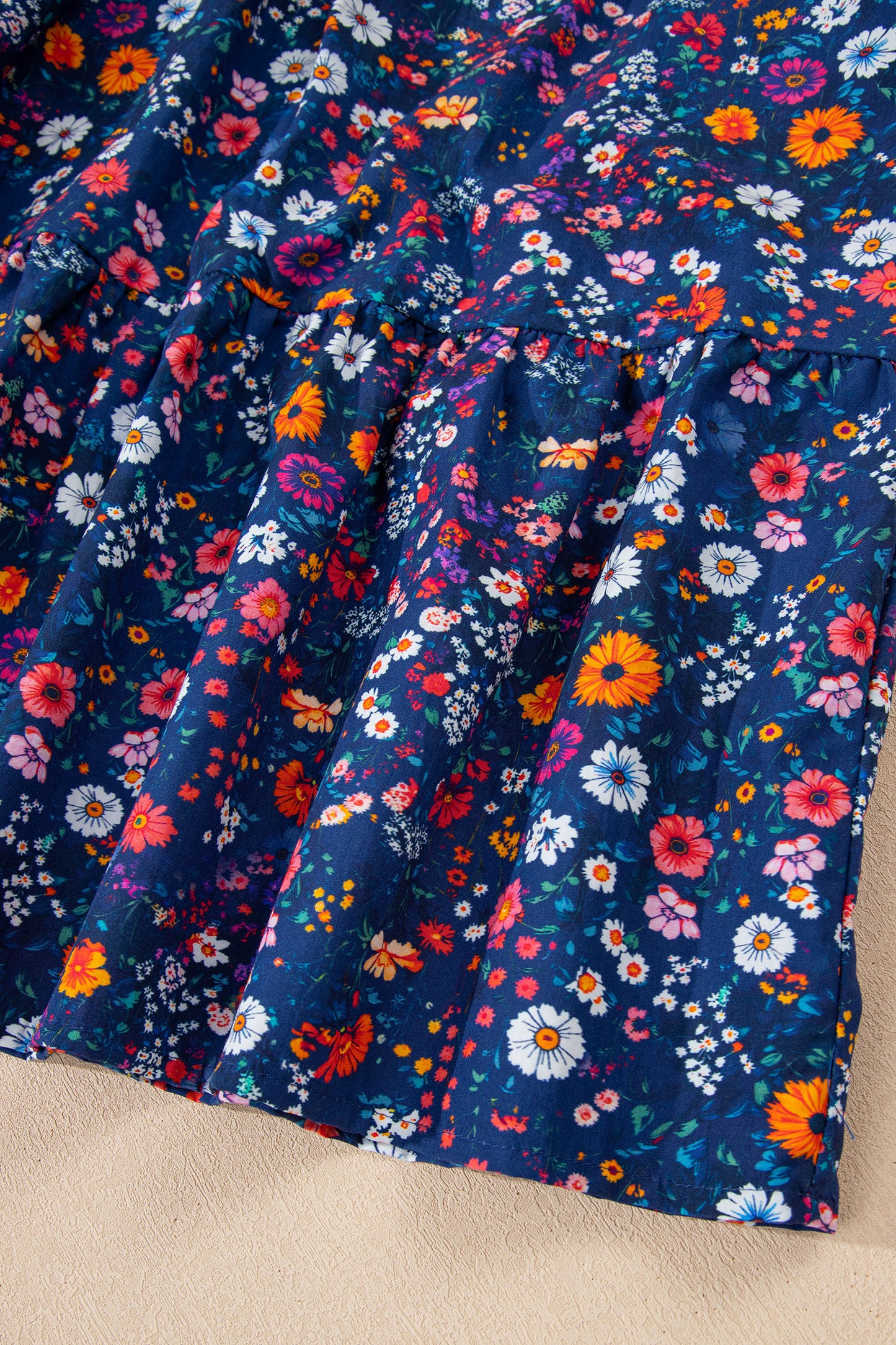 Blue Wild Daisy floral mini dress with split neckline and puff sleeves by Lavendar Lane Clothing, perfect for summer wear.