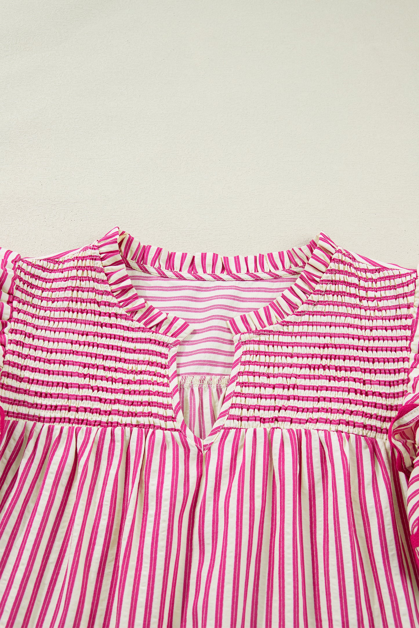 Lavendar Lane Clothing rose stripe shirred yoke ruffled short sleeve blouse with feminine design and floral pattern.
