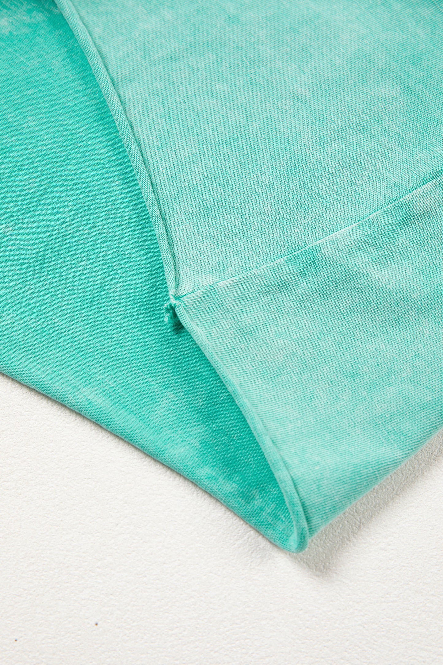Sea green mineral washed drawstring casual shorts with elastic waist and raw cut hem by Lavender Lane Clothing.