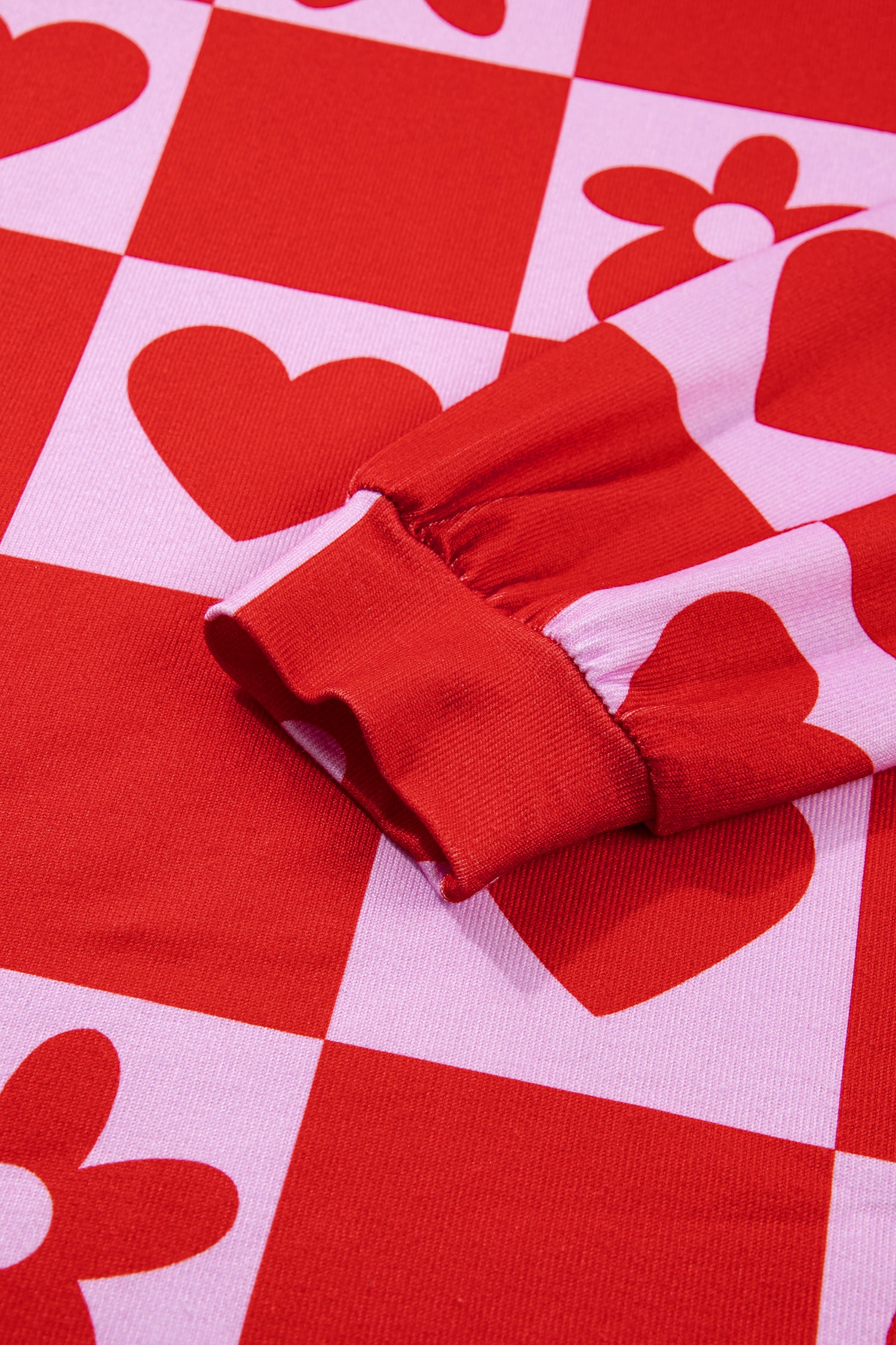 Lavendar Lane Clothing red dotted heart festive blouse, long-sleeve top with romantic heart pattern, perfect for Valentine's Day.