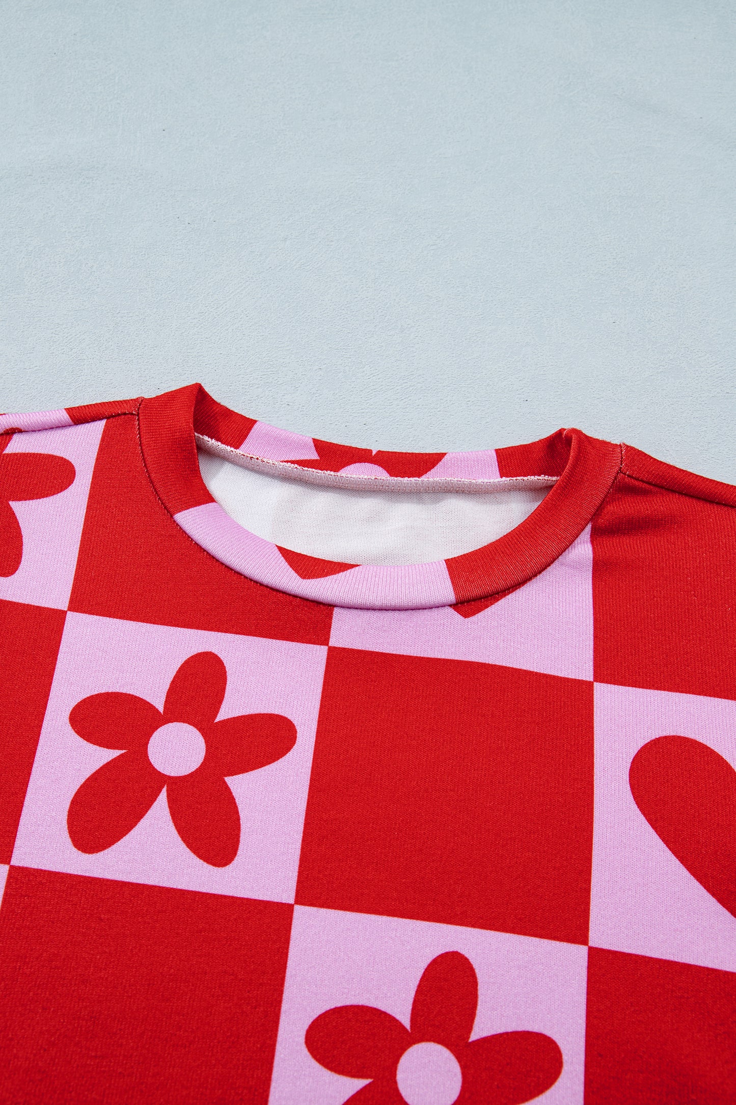 Lavendar Lane Clothing red dotted heart festive blouse, stylish women's top with playful heart pattern, perfect for Valentine’s Day.
