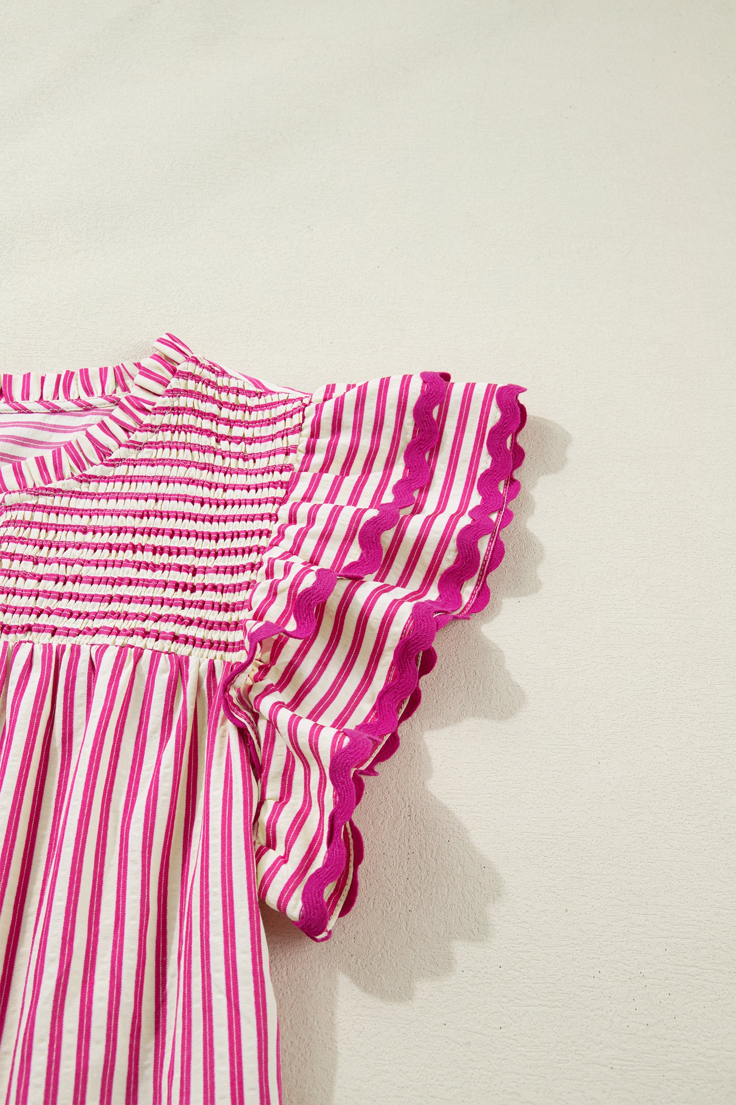 Lavendar Lane Clothing rose stripe short sleeve blouse with shirred yoke and ruffled details, perfect for casual or dressy occasions.