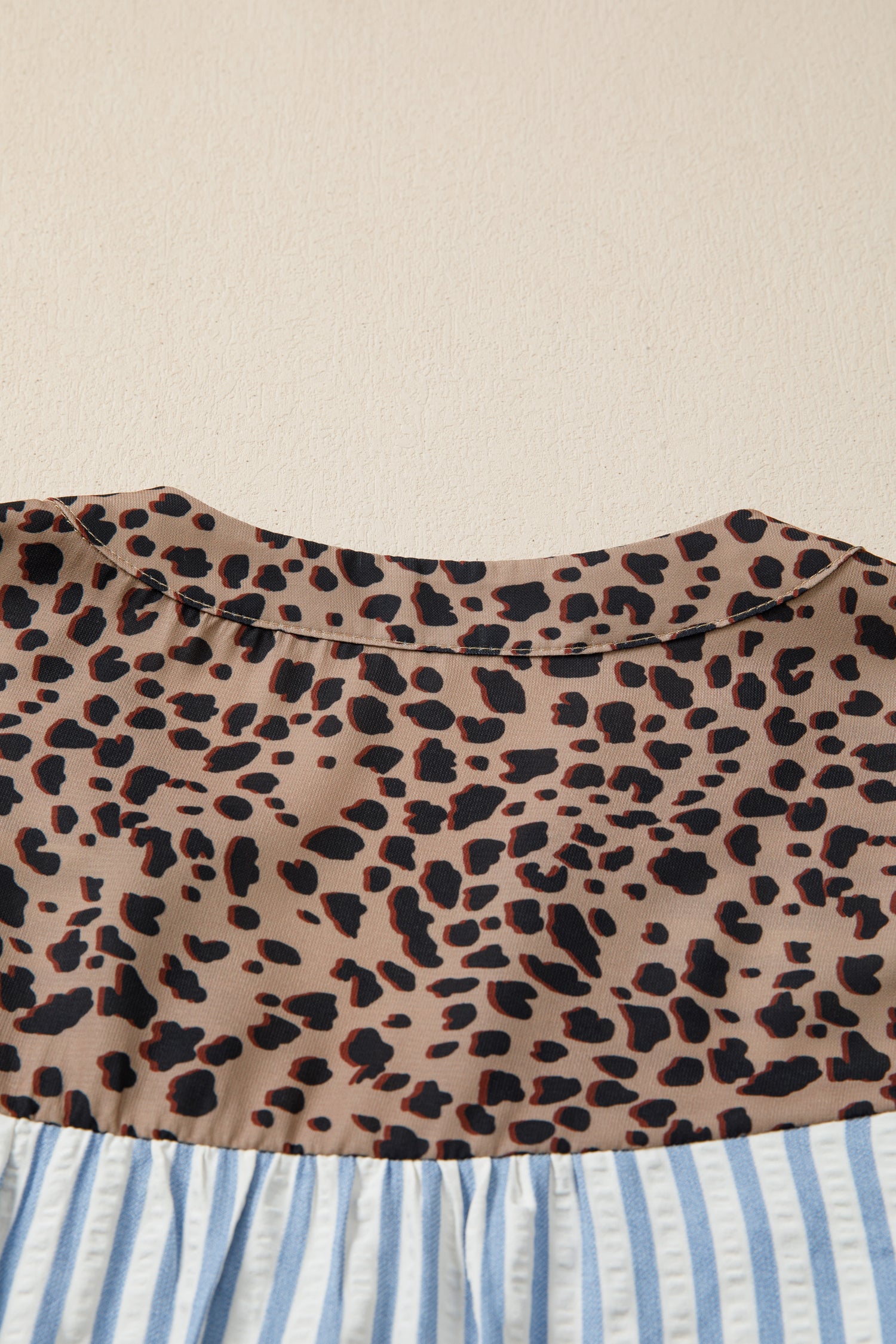 Sky blue stripe leopard trim V-neck button-down half sleeve shirt by Lavender Lane Clothing, featuring bold patterns and stylish design.