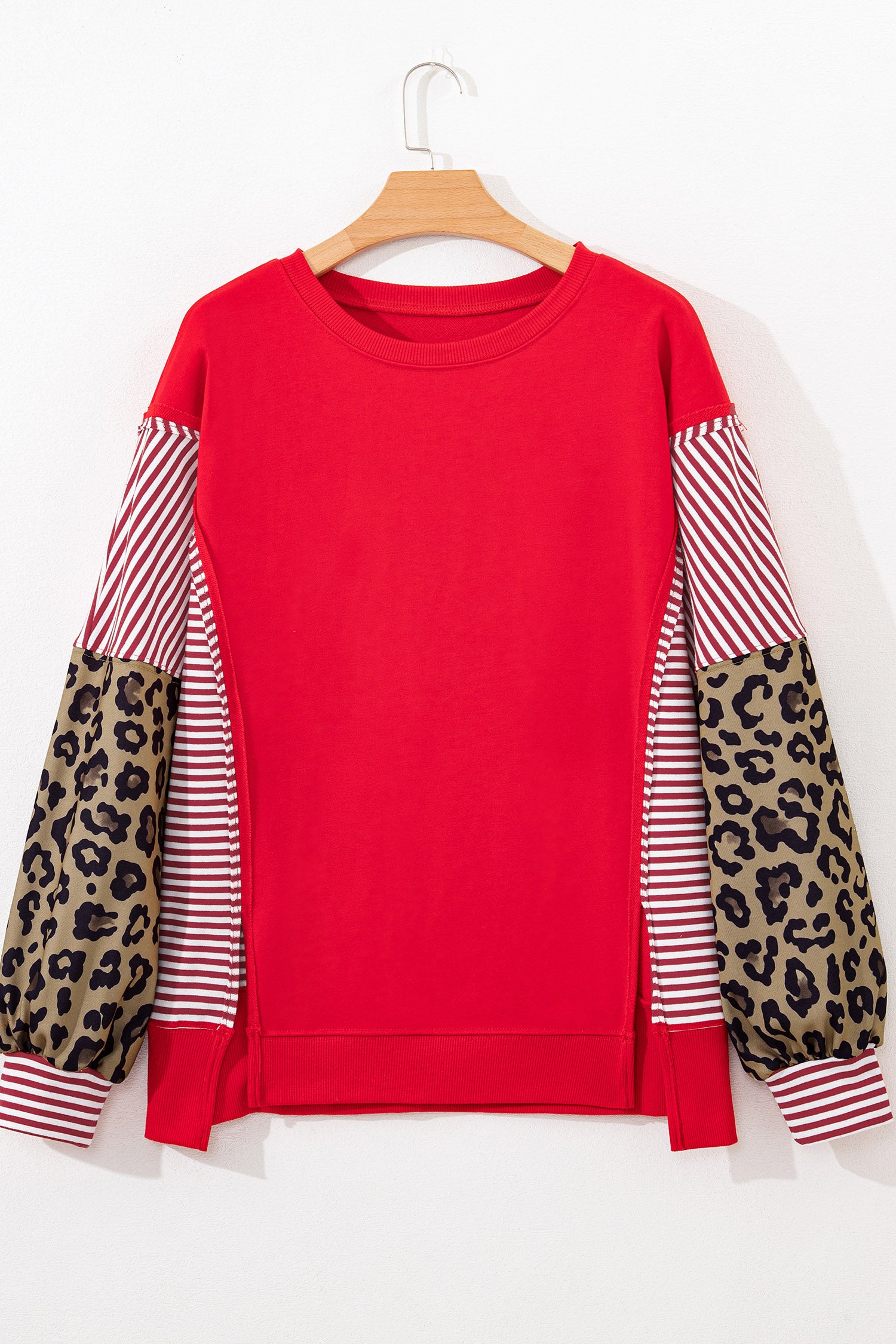 Racing red striped patchwork sleeve colorblock top by Lavendar Lane Clothing, featuring bold red, striped and colorblock design.