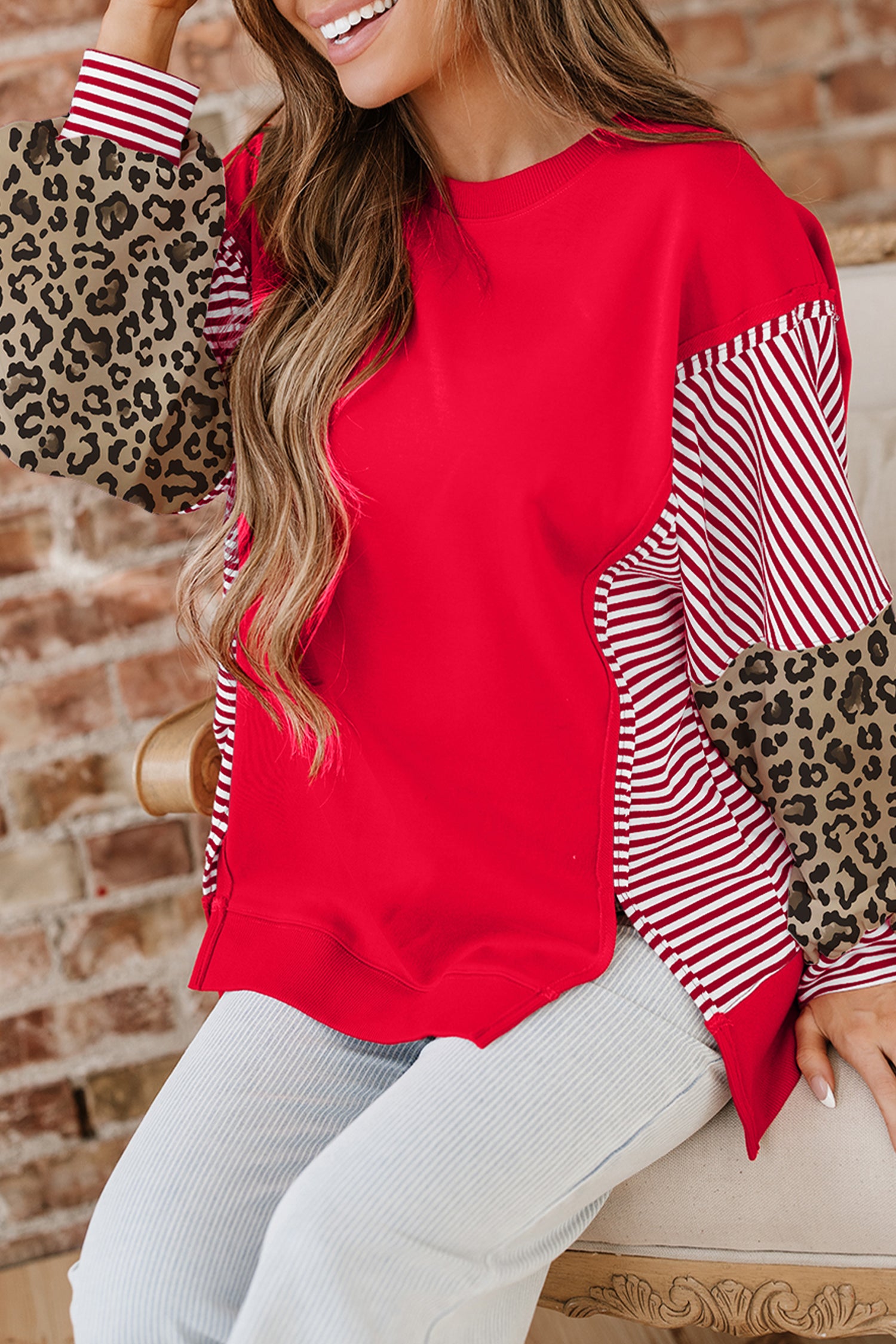 Racing Red striped patchwork sleeve colorblock top by Lavendar Lane Clothing, casual blouse with vibrant red and multicolor design.