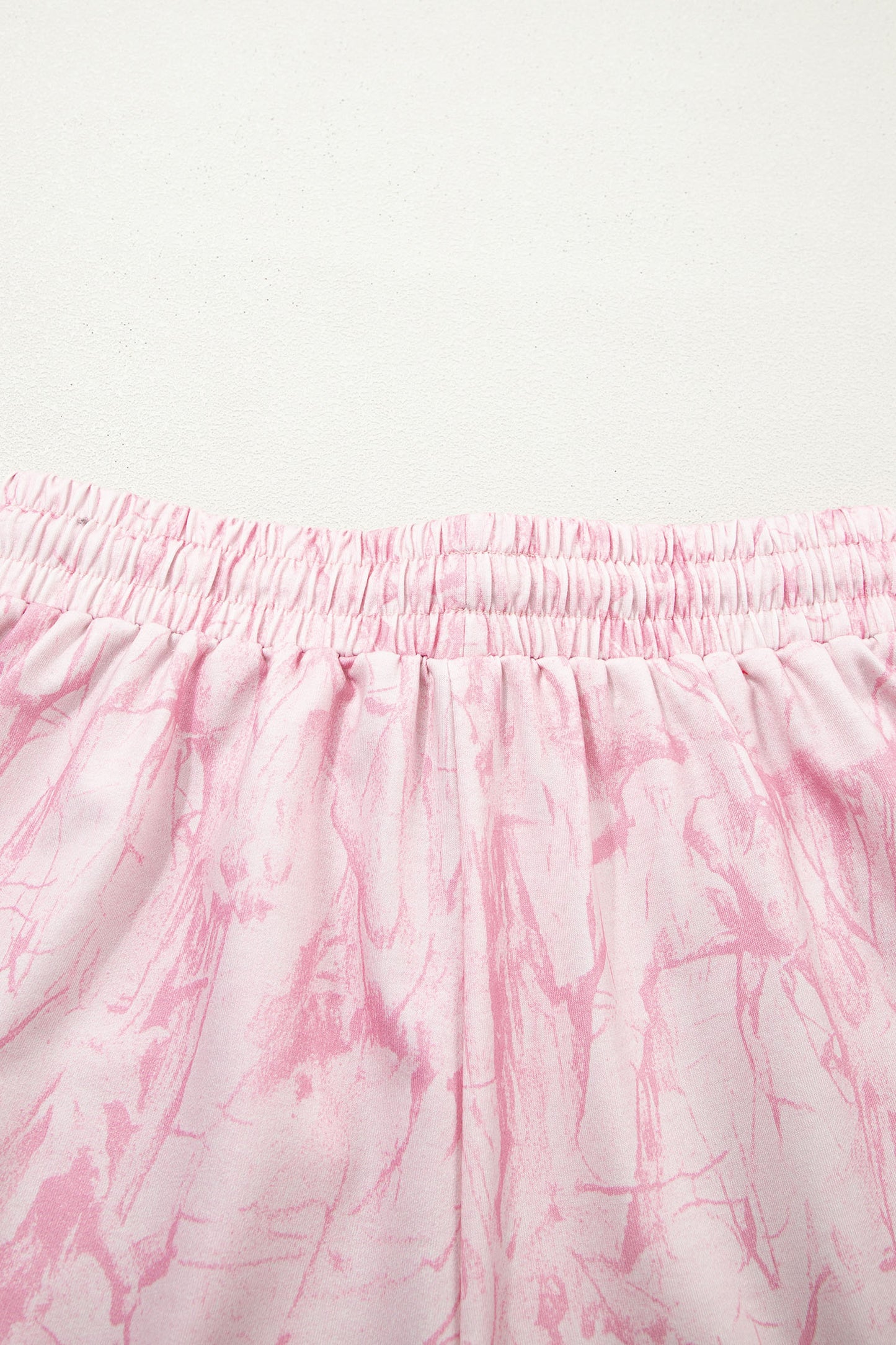 Pink abstract print V-neck loose tee with drawstring shorts, Lavendar Lane Clothing two-piece casual outfit.