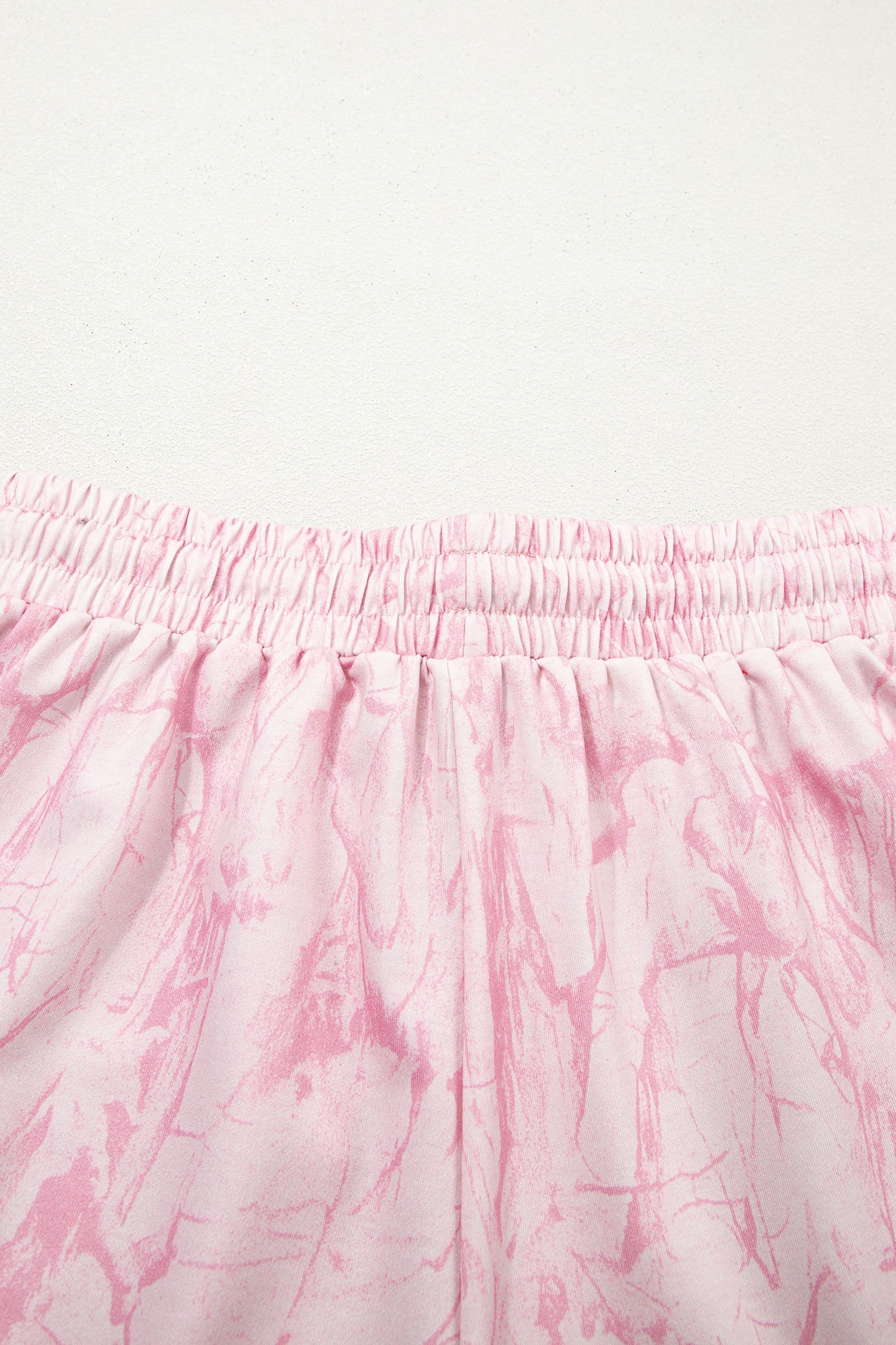 Pink abstract print V-neck loose tee with drawstring shorts, Lavendar Lane Clothing two-piece casual outfit.