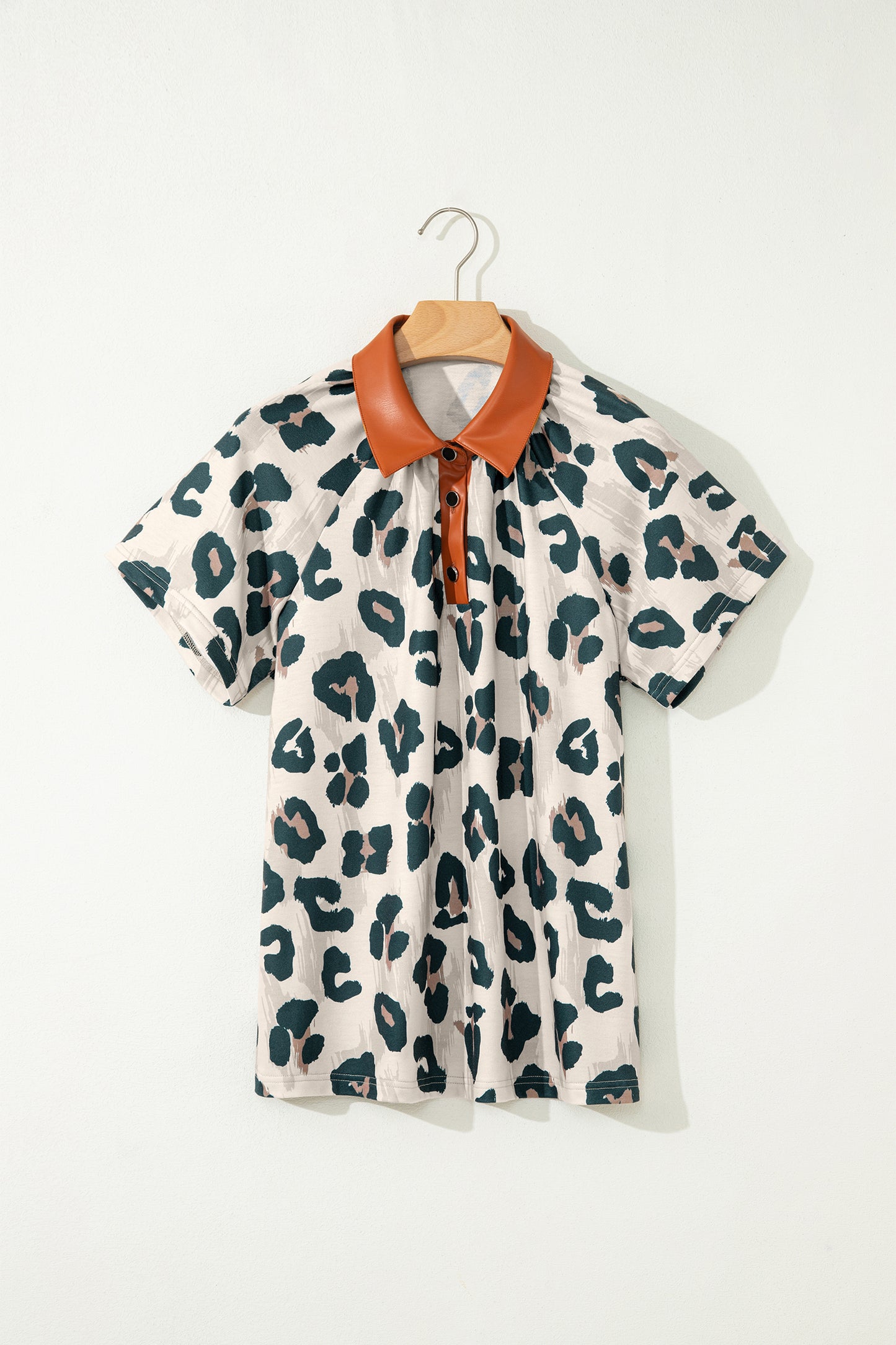 Lavendar Lane Clothing leopard print short sleeve blouse with button accents and contrasting collar, casual and unique top for women.