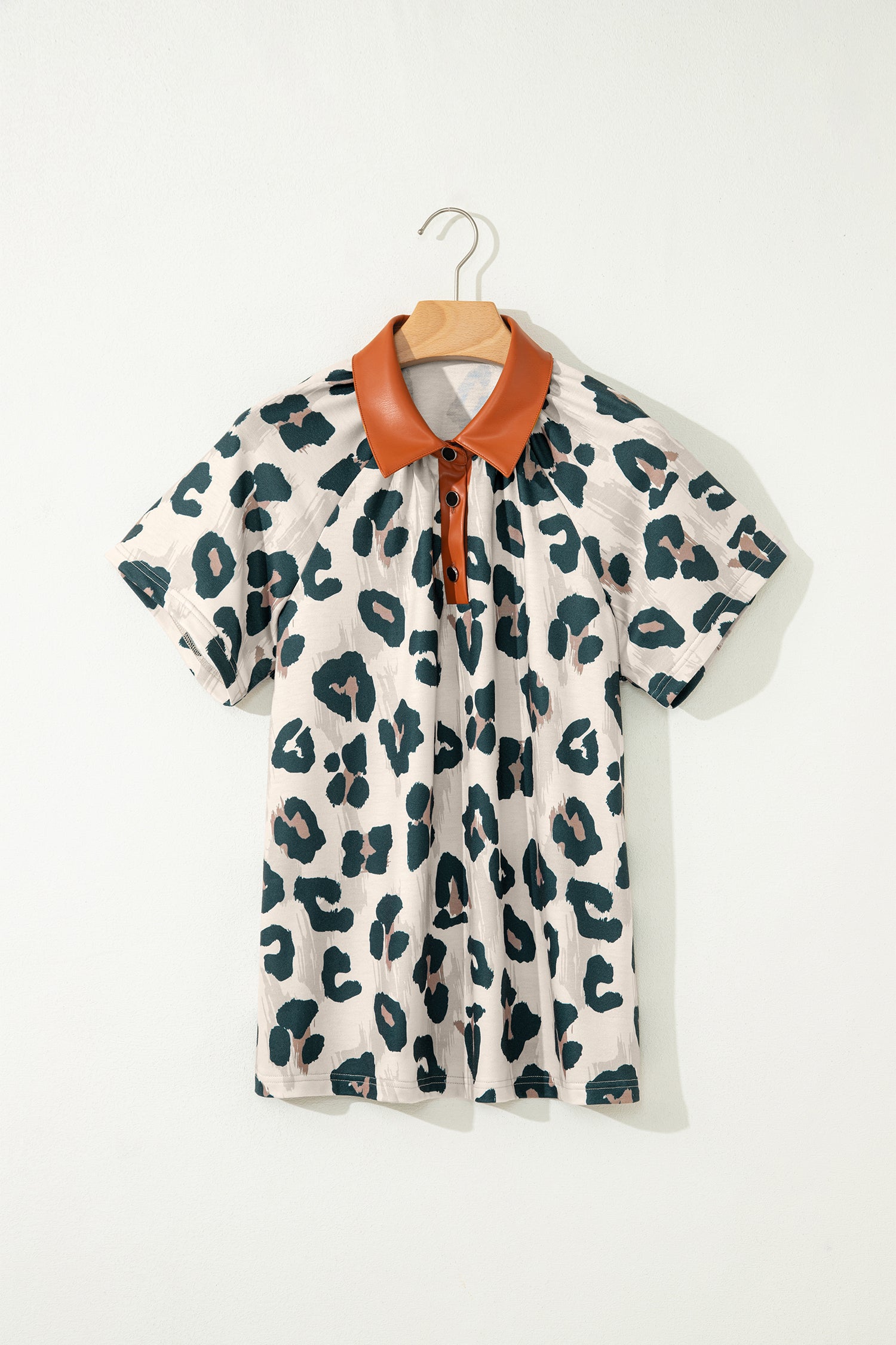 Lavendar Lane Clothing leopard print short sleeve blouse with button accents and contrasting collar, casual and unique top for women.