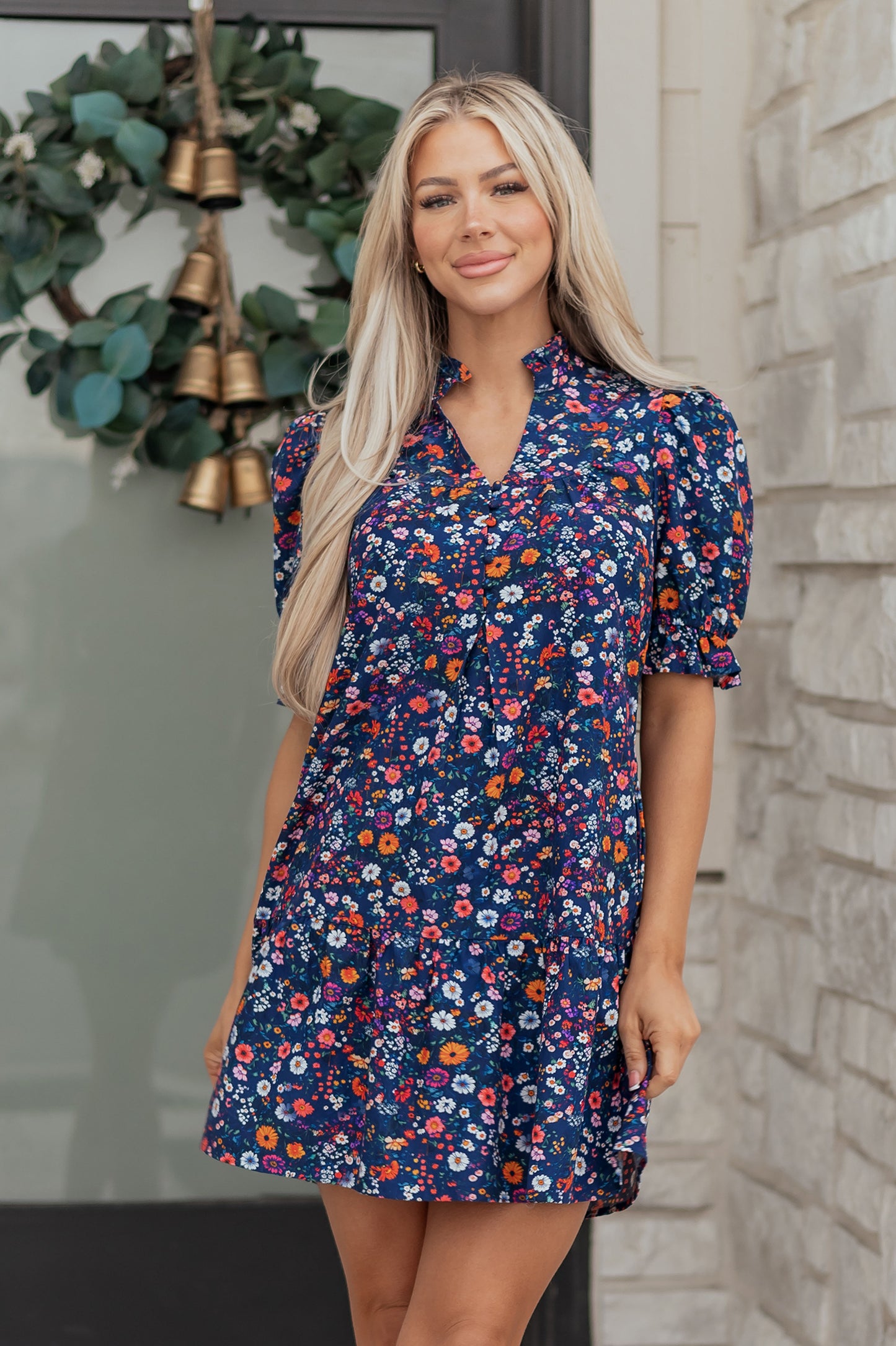 Blue Wild Daisy Floral Split Neck Short Puff Sleeve Mini Dress by Lavendar Lane Clothing, featuring a vibrant floral pattern and feminine design.