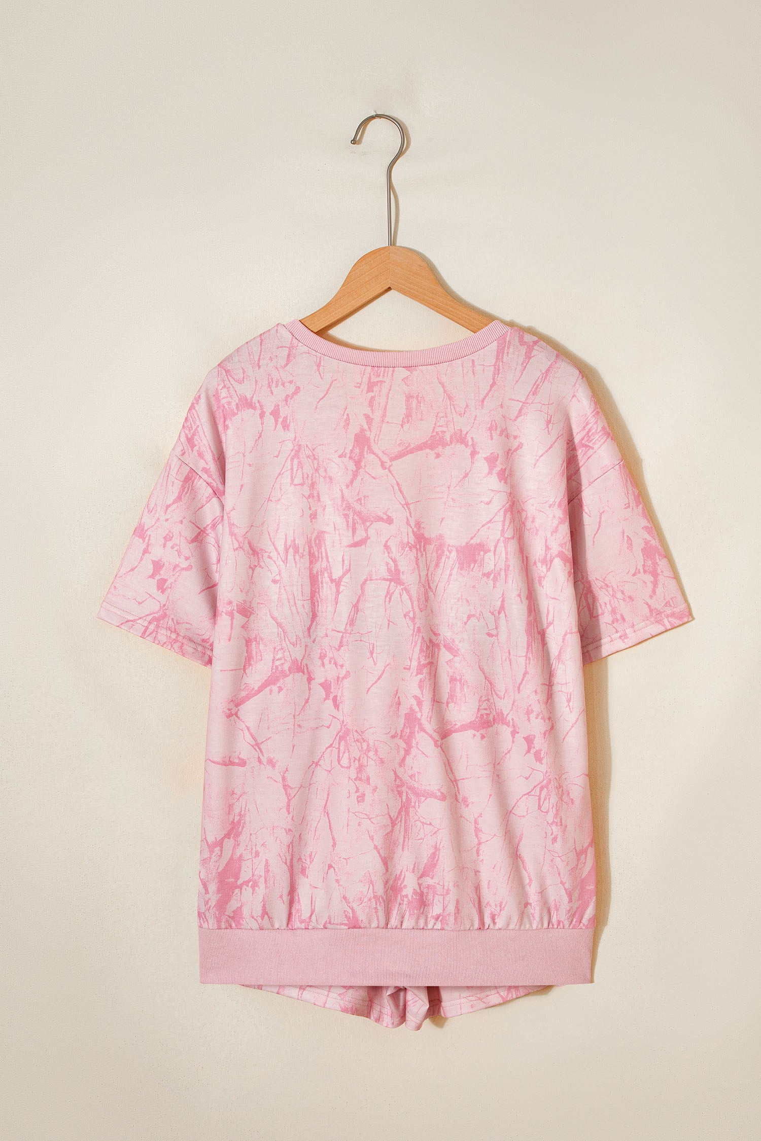 Pink abstract print V-neck loose tee with drawstring shorts, Lavendar Lane Clothing two-piece casual outfit.