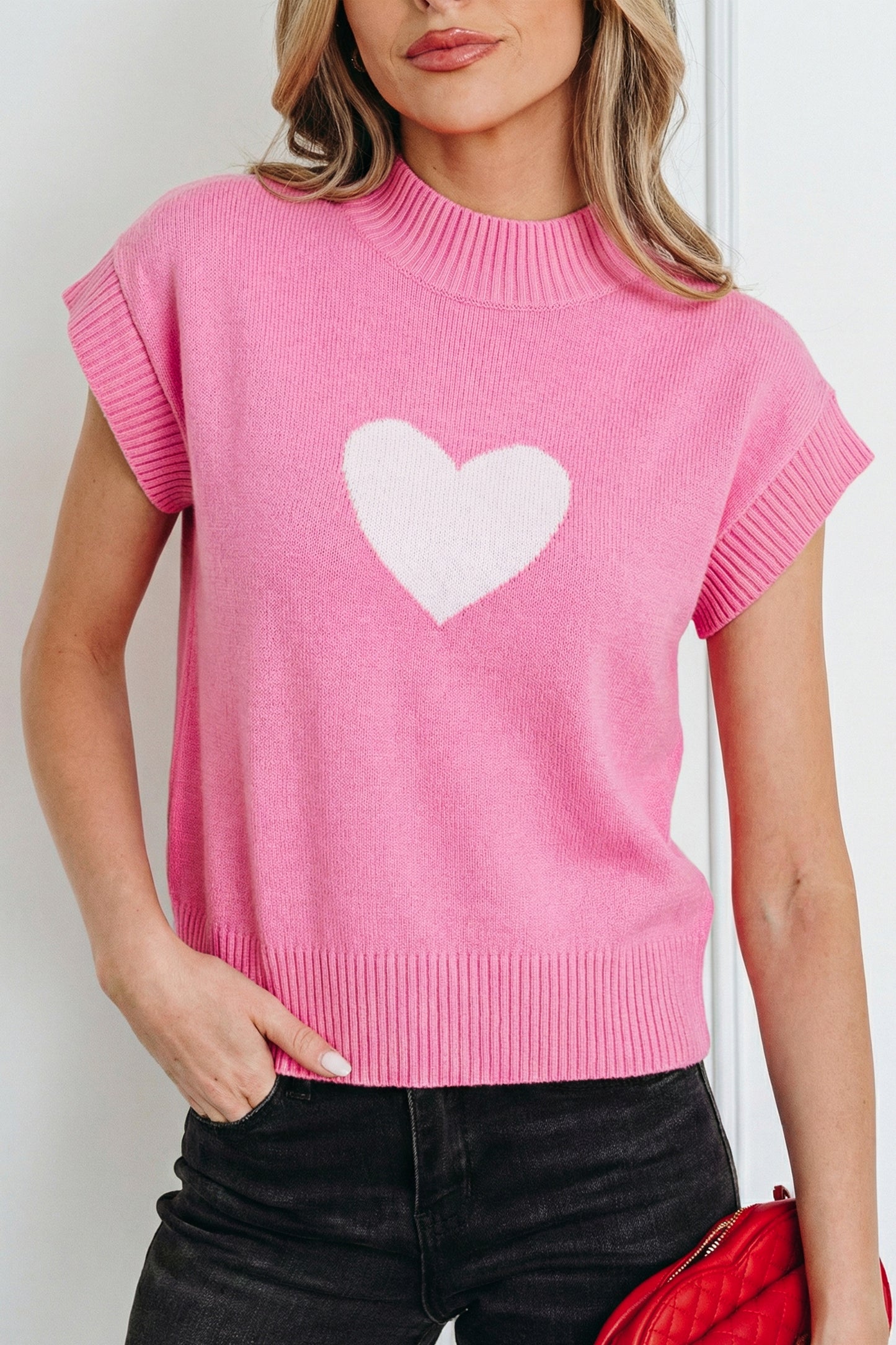 Pink Valentine heart graphic cropped short sleeve sweater from Lavendar Lane Clothing, featuring a playful heart design on the front.