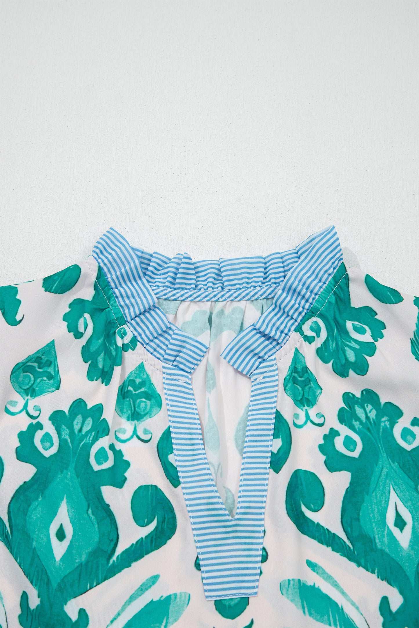 Sky blue ethnic print striped trim flutter sleeve top from Lavendar Lane Clothing, featuring a casual and stylish design.